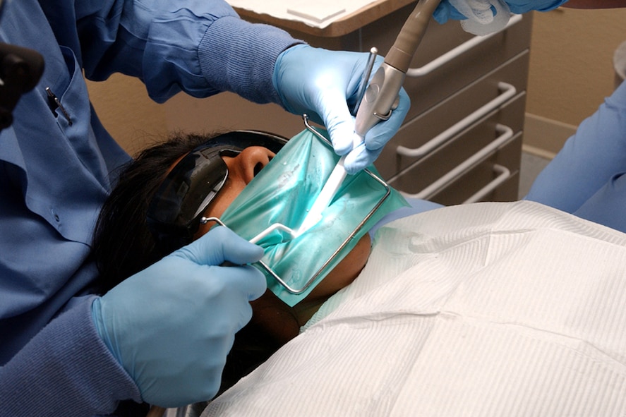 An Airman has a cavity filled at the 1st Special Operations Dental Squadron. Hurlburt Field has the highest cavity rate in the Air Force due to the frequency and length of deployments. Photo by Staff Sergeant Mareshah Haynes.