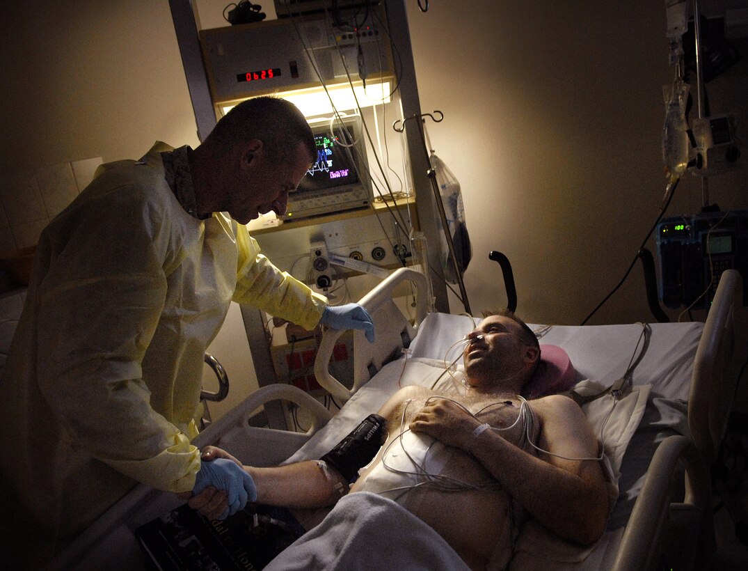 U.S. Marine Corps Gen. Peter Pace, chairman of the Joint Chiefs of Staff, visits patients at Landsthul Regional Medical Center, Germany, July 21, 2007.  Landstuhl is the largest American hospital outside the United States.