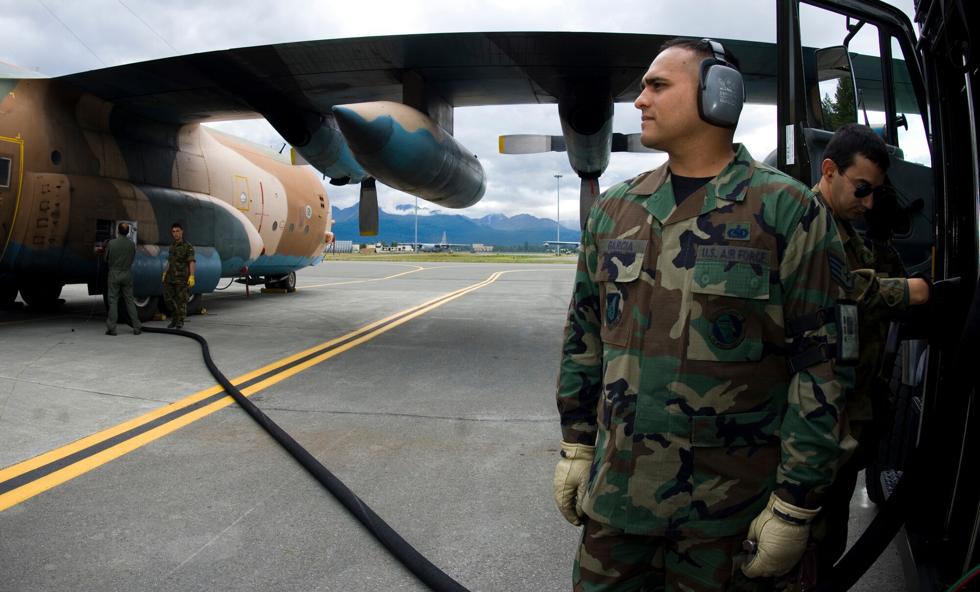 ELMENDORF AIR FORCE BASE, Alaska - Staff Sgt. Carlos Garcia, 3rd Logistics Readiness Squadron, helps fuel a C-130 from Spain during Red Flag-Alaska 2007. Sergeant Garcia is an Air Force liaison to the Spanish Air Force during this exercise. (U.S. Air Force Photo by Senior Airman Garrett Hothan)