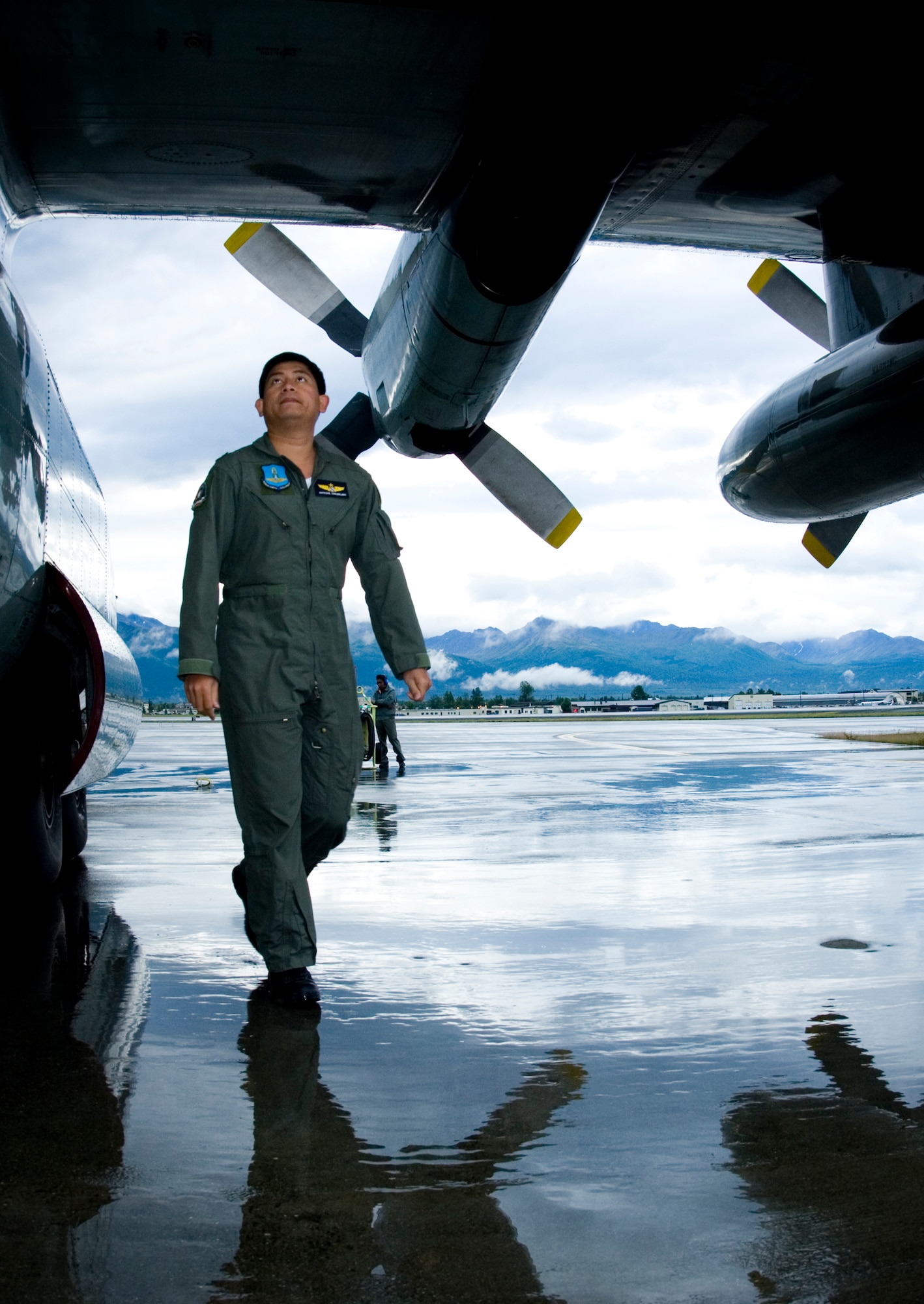 ELMENDORF AIR FORCE BASE, Alaska - Royal Thai Air Force Capt. Kittisak Chalawklang, does a pre-flight check around his C-130 during Red Flag-Alaska 2007. (U.S. Air Force Photo by Senior Airman Garrett Hothan)