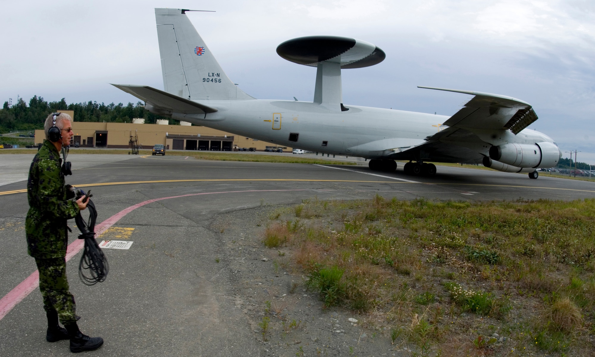 ELMENDORF AIR FORCE BASE, Alaska - Staff Sgt. Preben Andersen, a Denmark crew chief with NATO, looks on as his AWACS taxis down the runway during Red Flag-Alaska 2007. (U.S. Air Force Photo by Senior Airman Garrett Hothan)