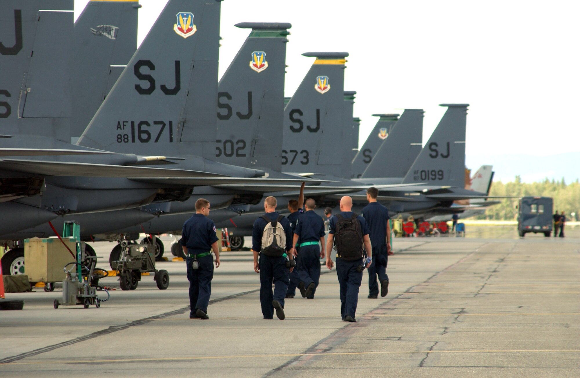 EIELSON, AFB, Alaska -- Several F-15E Strike Eagle maintainers deployed here from the 4th Fighter Wing at Seymour Johnson, N.C. for Red Flag Alaska head out to the jets prior to a a wave of take-offs July 19, 2007.  (U.S. Air Force photo by Capt. Tana R.H. Stevenson)                               