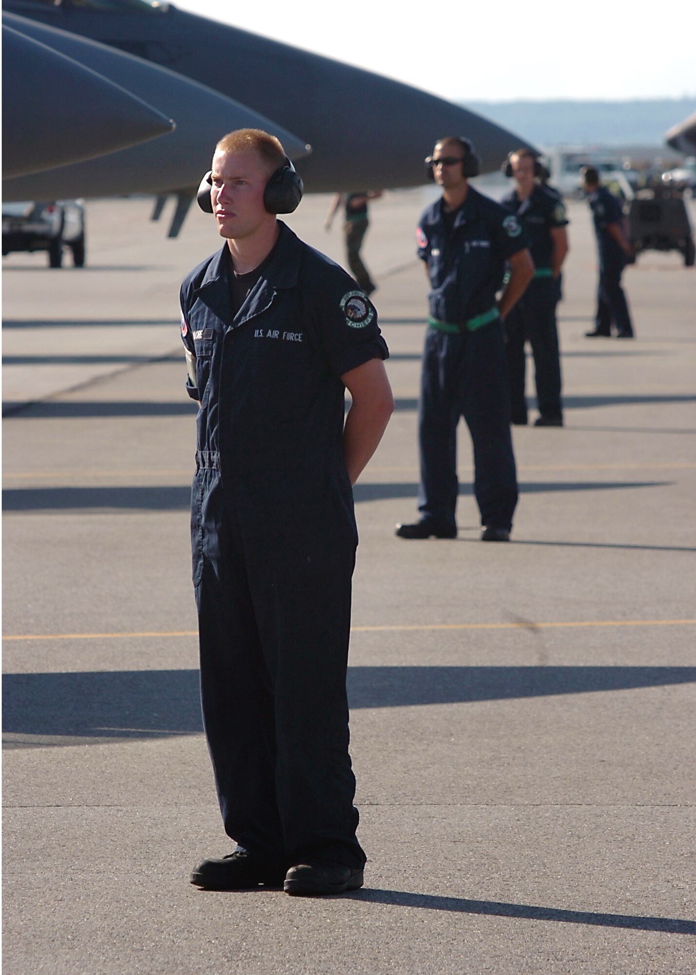 EIELSON AIR FORCE BASE, Alaska -- Senior Airman Paul Moore, 4th Aircraft Maintenance Squadron, leads a line of crew chiefs prior to launching their F-15E Strike Eagles at Red Flag-Alaska, a multinational air combat training exercise. (U.S. Air Force photo by MSgt Brandt Smith)