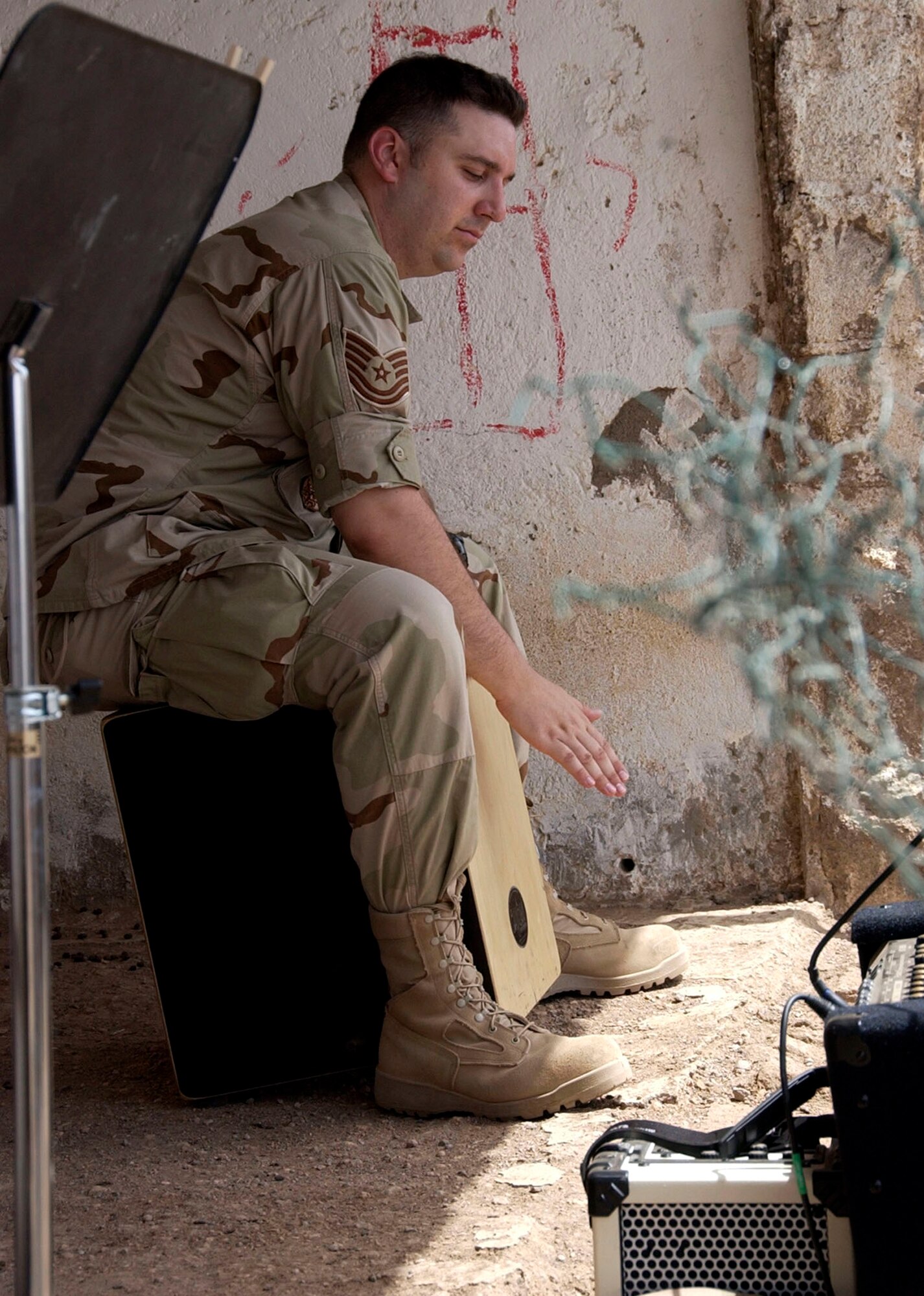 Tech. Sgt. Joe Filipek keeps the beat during a small concert in the Djiboutian village of Nagad in June. Sergeant Filipek and the other musicians were deployed as the Central Air Forces band "Thunder Roll" and are assigned to the Illinois Air National Guard's Band of the Midwest. (U.S. Air Force photo/Staff Sgt. Samuel King Jr.)                           