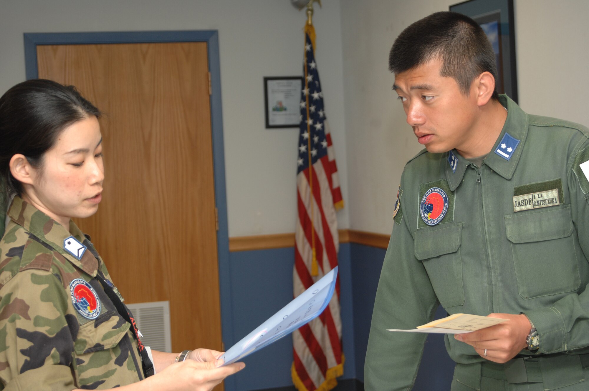 EIELSON AIR FORCE BASE, Alaska -- Members of the 7th Air Wing, Japan Air Self-Defense Force take part in the voting of their countries government official elections here while they participate in Red Flag 07-3 on July 23, 2007.  The exercise is focused on improving the combat readiness of U.S. forces and providing training for units preparing for air expeditionary force taskings. International partners will include Japan, Mongolia, Spain, Thailand, Turkey and NATO. (U.S. Air Force Photo by Staff Sgt. Tia Schroeder) 