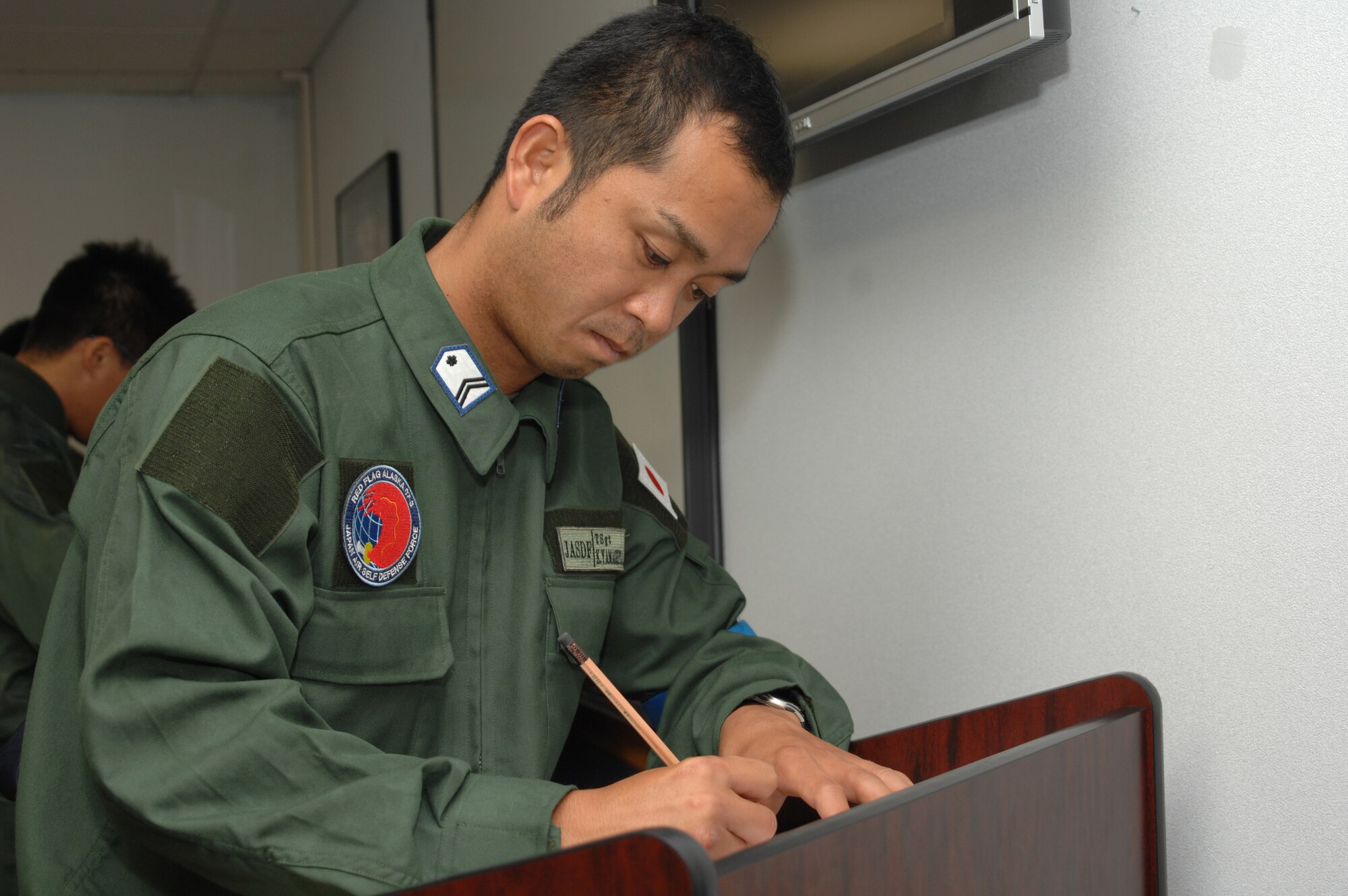 EIELSON AIR FORCE BASE, Alaska -- Members of the 7th Air Wing, Japan Air Self-Defense Force take part in the voting of their countries government official elections here while they participate in Red Flag 07-3 on July 23, 2007.  The exercise is focused on improving the combat readiness of U.S. forces and providing training for units preparing for air expeditionary force taskings. International partners will include Japan, Mongolia, Spain, Thailand, Turkey and NATO. (U.S. Air Force Photo by Staff Sgt. Tia Schroeder) 