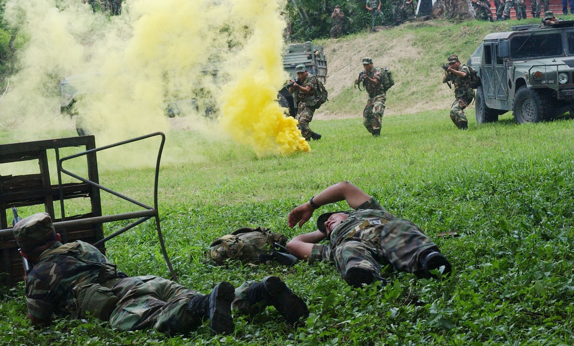 El Salvadorian soldiers neutralize the enemy during a culmination exercise that followed a week-long training mission with members of Joint Task Force-Bravo. During a week-long training mission, soldiers were taught force protection measures, convoy defense skills and improvised explosive device detection, to prepare them for their upcoming deployment in support of Operation Iraqi Freedom. (U.S. Air Force photo/Senior Airman Shaun Emery)