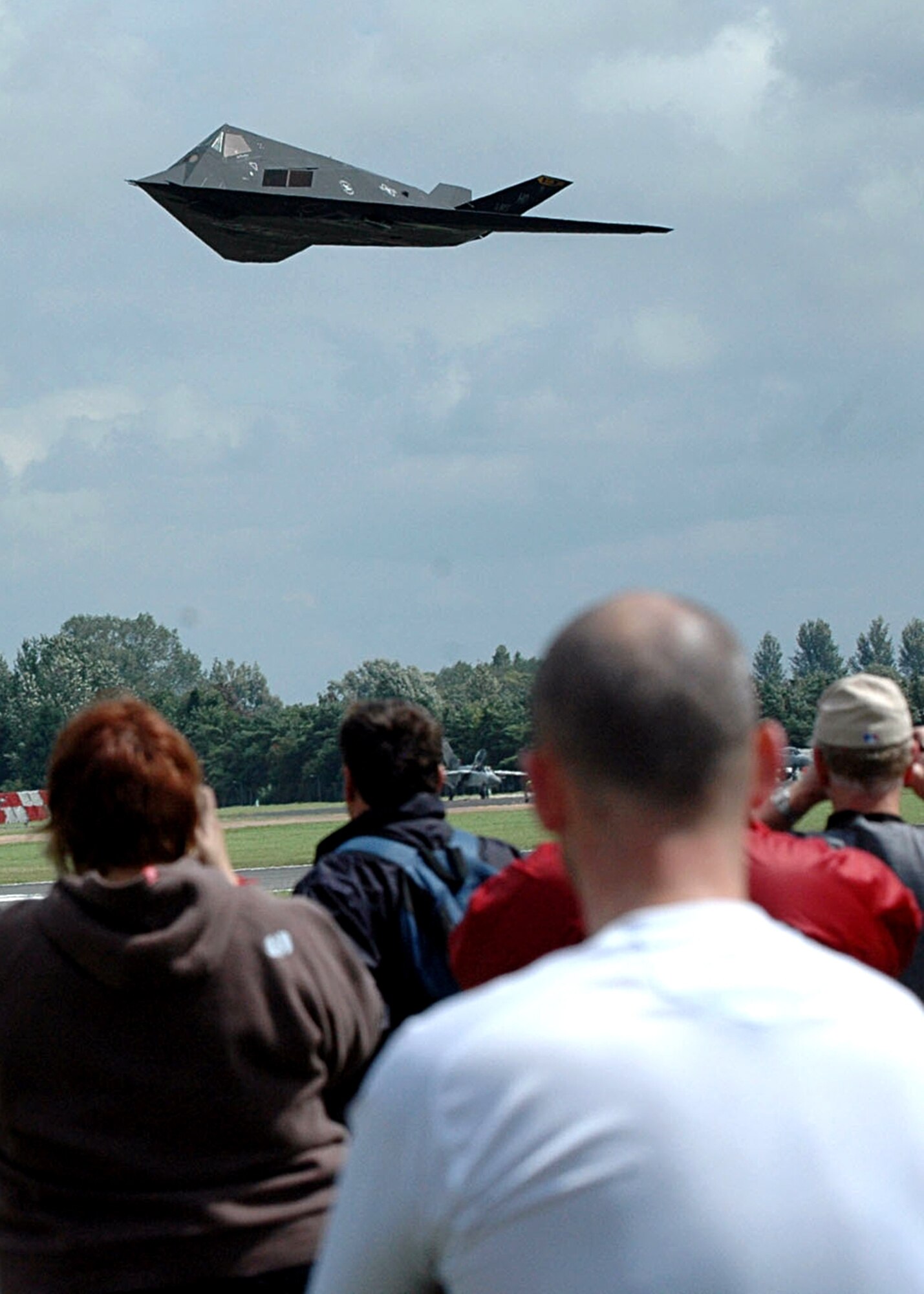 An F-117A from the 49th Operations Group makes a low pass in front of a crowd of thousands attending the first day of the Royal International Air Tattoo at Fairford, United Kingdom, July 14. The Nighthawk's appearance at this year's RIAT will likely be its last at the annual event as the black jet is slated for retirement by September 2008. (U.S. Air Force photo/ Mr. Tommy Fuller)