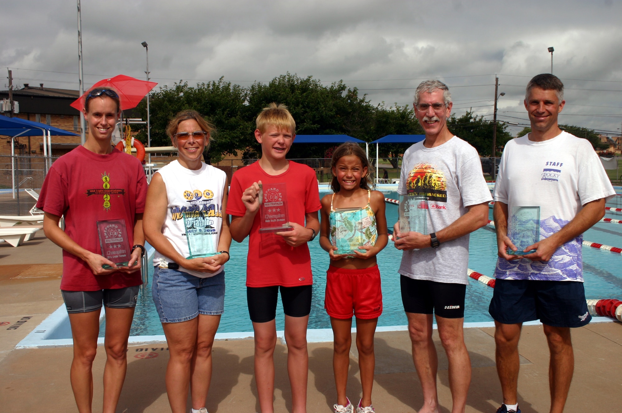 The first place winners of the 82nd Services Squadron's mini-triathalon, from left: Katherine Roberts, 82nd Medical Operations Squadron, in the females 39-under division; Kate Teichman in the females 40-over division; Adam Leslie in the male youth division; Katie Alfred in the female youth division; Larry Schmeltzer, 82nd Dental Squadron, in the males 40-over division; and Maj. David Otto, 97th Flying Training Squadron, in the males 39-under division. (U.S. Air Force photo/Staff Sgt. Tonnette Thompson)