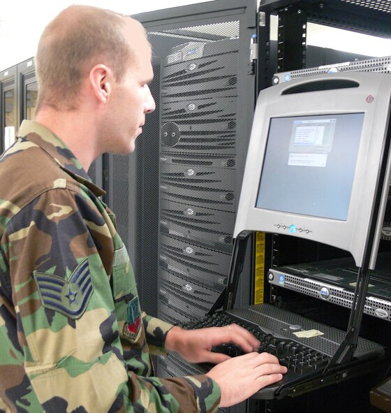Staff Sgt. Salvatore Lione, 23rd Communications Squadron, works with one of the Network Control Center's consoles. The Air Force recently unveiled plans for E-mail for Life, a system that will cease base-level e-mail and allow Airmen and government service civilians to access Web-based mail via any common access card accessible computer. (U.S. Air Force photo by Airman 1st Class Eric Schloeffel)