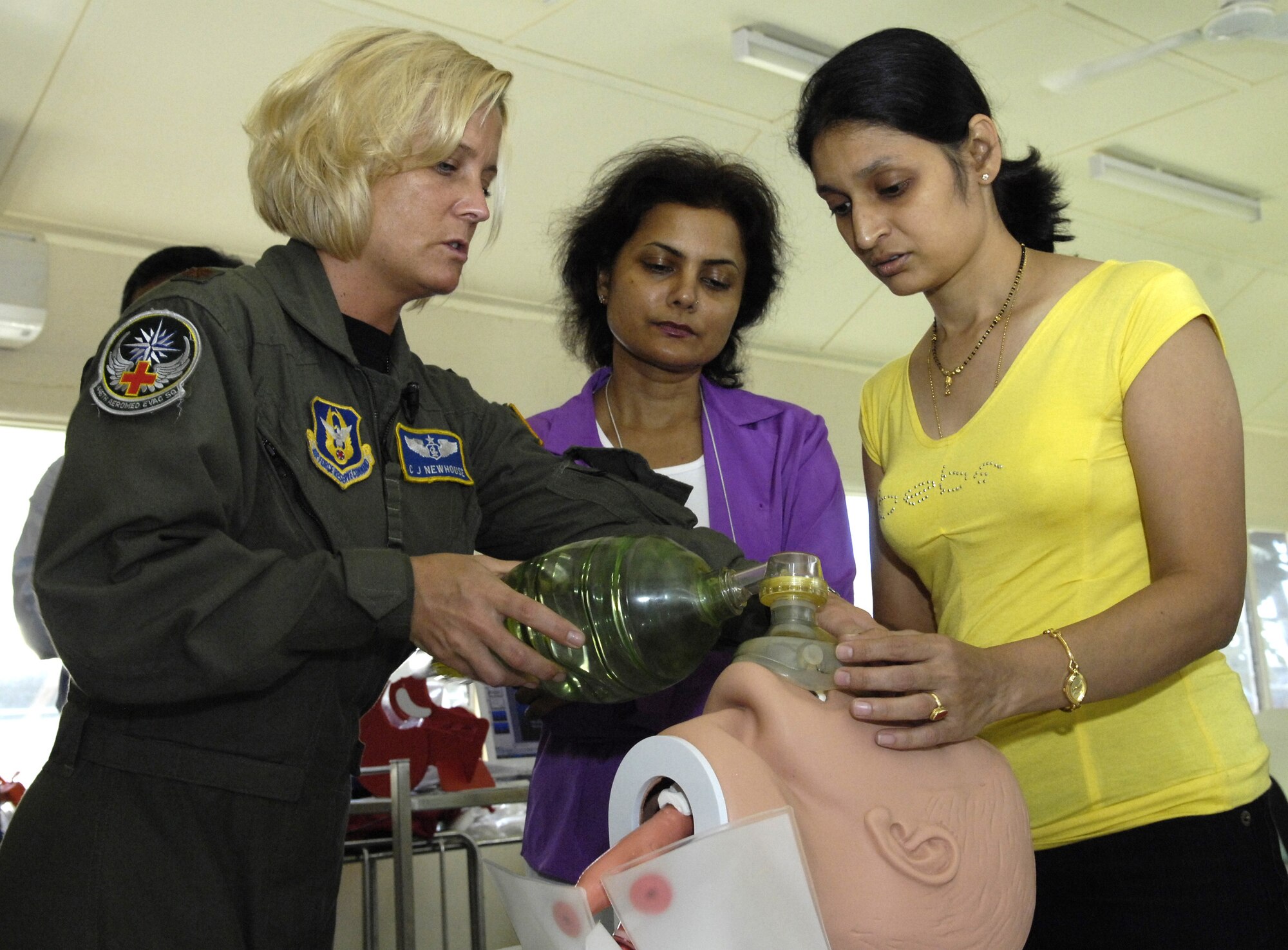 NAURU -- Maj. C.J. Newhouse conducts emergency airway training for Dr. Jyoti Dubey and Dr. Deepti Datey. Major Newhouse, an Air Force Reserve flight nurse with the 446th Aeromedical Evacuation Squadron, is part of 12-person U.S. Pacific Command medical team visiting Nauru, a small island in the South Pacific, from July 21 - 28. (U.S. Air Force photo by Tech. Sgt. Chris Vadnais)