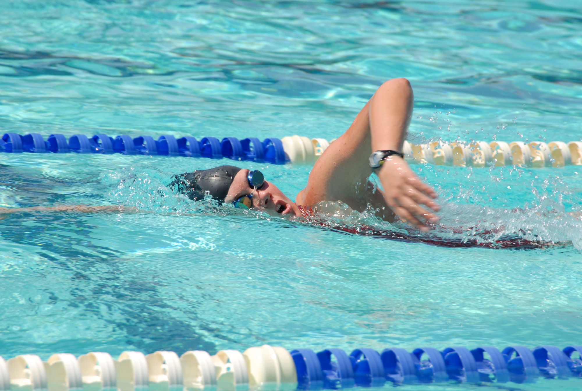 First Lt. Lisa Newman-Wise swims laps in the Sonic Splash Pool here to prepare for the Ironman World Championship Triathlon, slated for Oct. 13 in Kona, Hawaii. Lieutenant Newman-Wise will represent the Air Force as part of a four-person team, competing against the other services. (Photo by Airman 1st Class Mike Young)