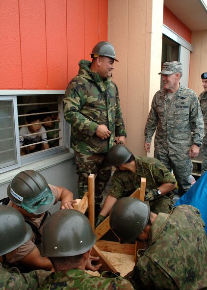 Lt. Gen. Bruce Wright U.S. Forces Japan commander meets with Seabees from Navy facility Atsugi and Japanese Ground Self Defense Force members providing construction support to people affected by the July 16 earthquake in Niigata, Japan.
(U.S. Air Force Photo by Senior Airman Veronica Pierce)