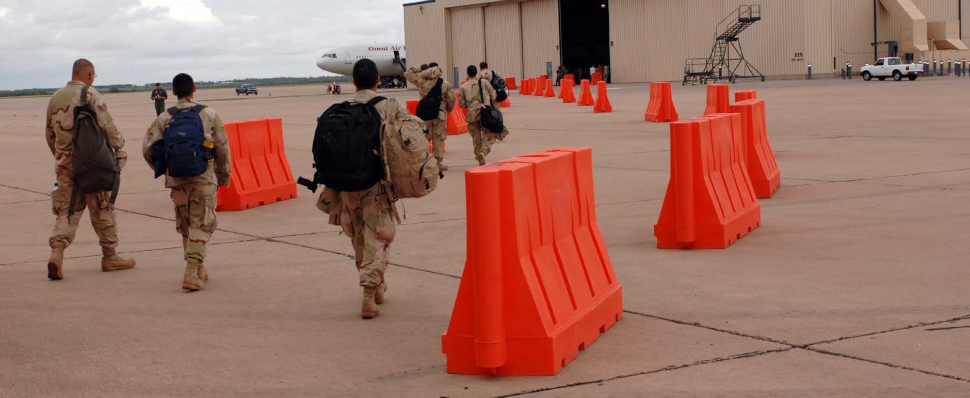 DYESS AIR FORCE BASE, Texas -- Airmen leave Dyess to board a plane headed for deployment in the area of responsibility July 20. (U.S. Air Force photo/Senior Airman Courtney Garrard)