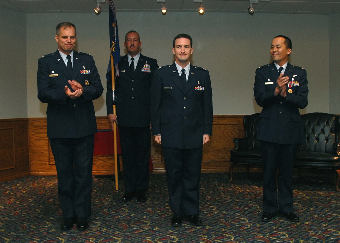 Col. James King, 82nd Medical Group commander, stands with outgoing 82nd Medical Operations Squadron commander Col. John Chu and incoming 82nd MDOS commander Lt. Col. Bret Burton at the 82nd MDOS change of command ceremony July 20 at the Sheppard Club. (U.S. Air Force photo/Mike Litteken)