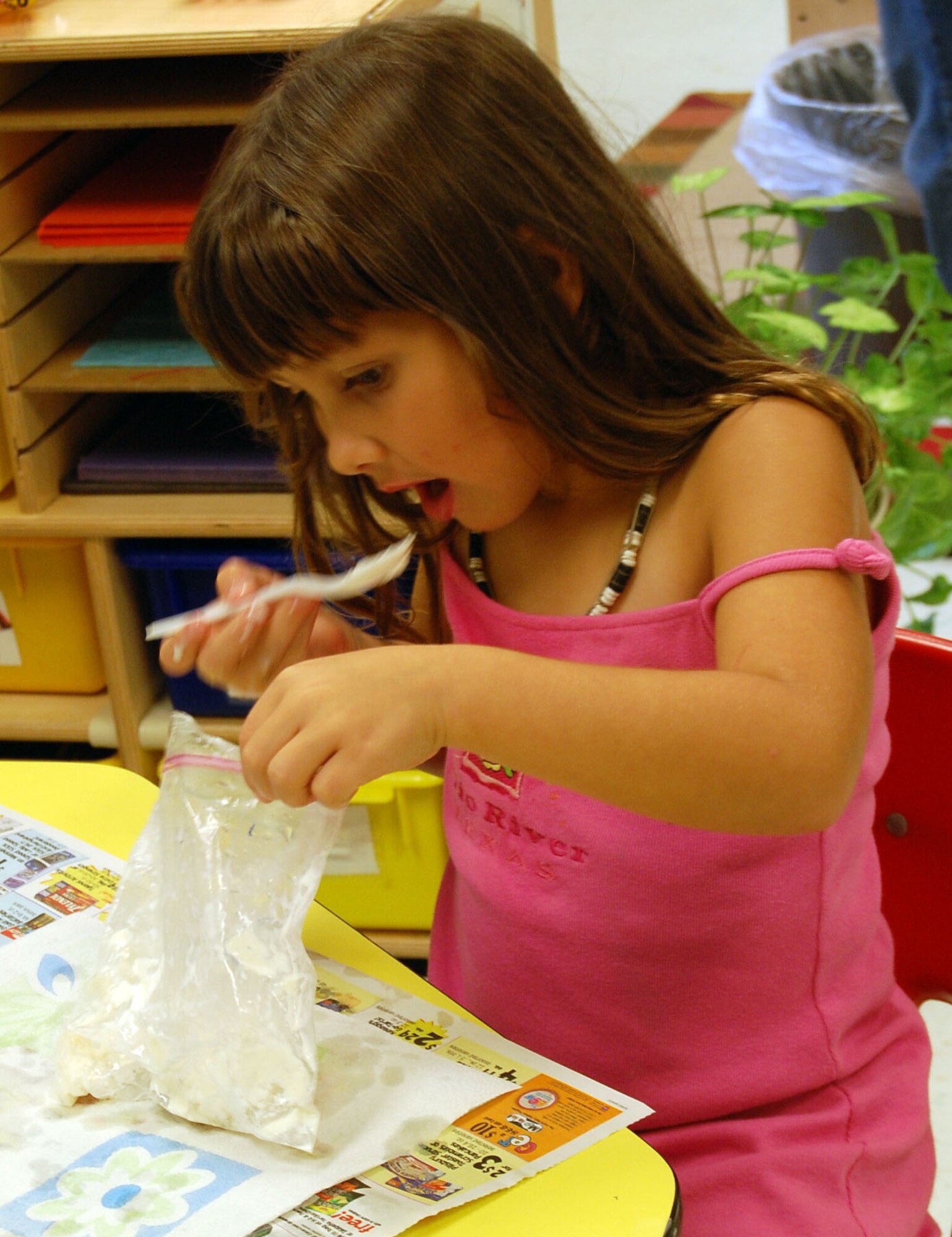 LAUGHLIN AIR FORCE BASE, Texas -Shalie Jones, daughter of Mr. Jimmy and Mrs. Susan McDonald, enjoys her homemade ice cream after learning how to make it at Science Adventure Camp at Laughlin's Youth Center. Science Adventures is a week-long specialty camp that is held once a year at Laughlin?s Youth Center to teach children different things about science. (U.S. Air Force photo by Airman Sara Csurilla)