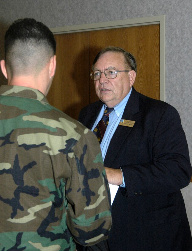 Gary Brown, one of the Air Reserve Personnel Center cadre members, answers a question from a reservist who attended a combined training assembly recently at F.E. Warren Air Force Base, Wyo. (U.S. Air Force photo/Master Sgt. J.C. Woodring)