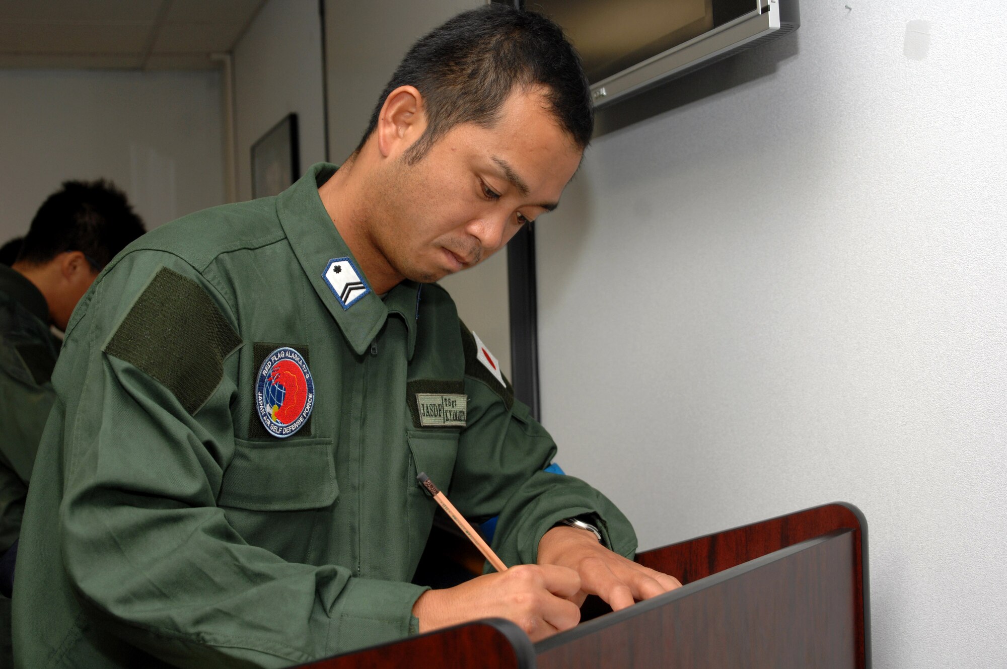 The members of the Japan Air Self-Defense Force's 7th Air Wing, at Eielson Air Force Base, Alaska, to participate in Red Flag-Alaska 07-3, were able to vote in their country's official elections July 23rd at an absentee voting area set up on the base.  (U.S. Air Force photo/Staff Sgt. Tia Schroeder)
