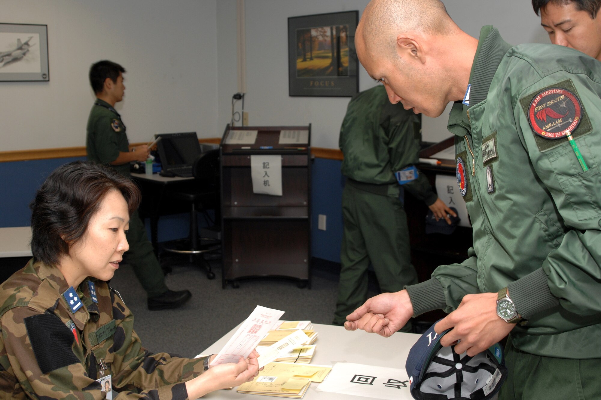 The members of the Japan Air Self-Defense Force's 7th Air Wing, at Eielson Air Force Base, Alaska, to participate in Red Flag-Alaska 07-3, were able to vote in their country's official elections July 23rd at an absentee voting area set up on the base.  (U.S. Air Force photo/Staff Sgt. Tia Schroeder)