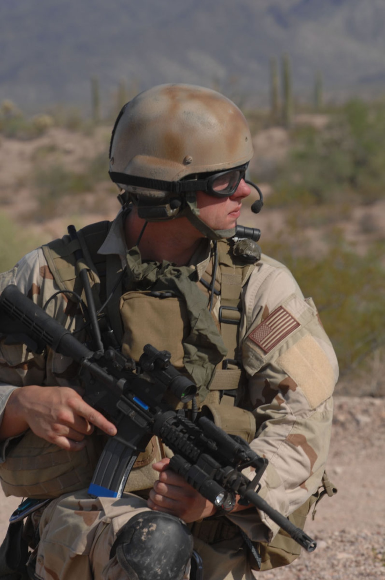 Senior Airman Eric Huff, 48th Rescue Squadron pararescueman, maintains cover for his team mates during exercise Angel Thunder in Gila Bend. Angel Thunder is a combat search and rescue task force exercise designed to test theater spin-up capabilities and examine the integration of all Air Force assets in mission planning procedures and mission execution. (U.S. Air Force photo/Staff Sgt Lanie McNeal)