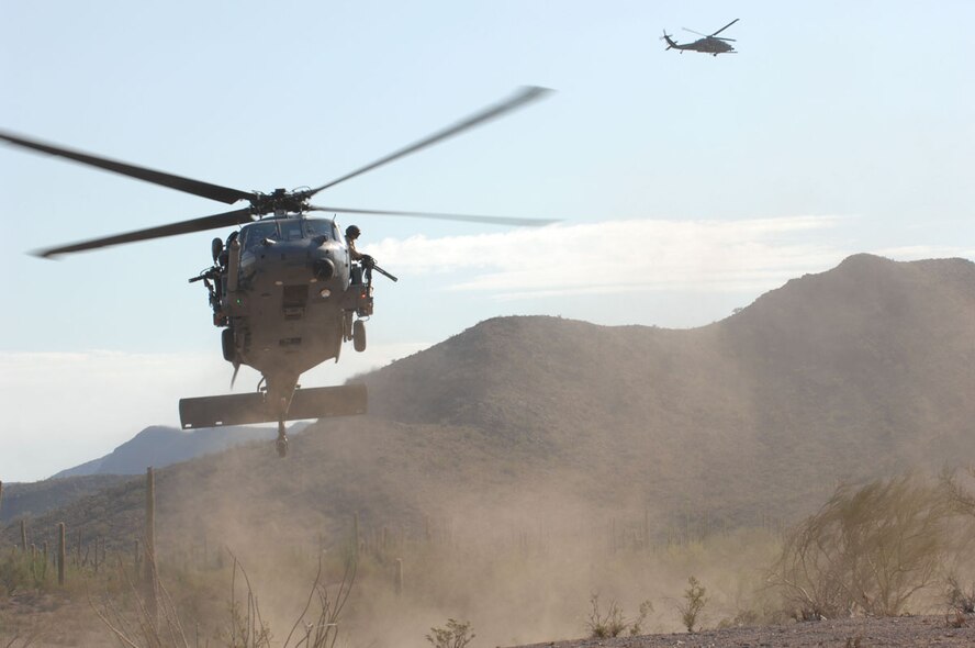 55th Rescue Squadron HH-60 helicopters provide transportation for 48th RQS pararescueman during exercise Angel Thunder in Gila Bend,AZ.Senior. Angel Thunder is a combat search and rescue task force exercise designed to test theater spin-up capabilities and examine the integration of all Air Force assets in mission planning procedures and mission execution. (U.S. Air Force photo/Staff Sgt Lanie McNeal)