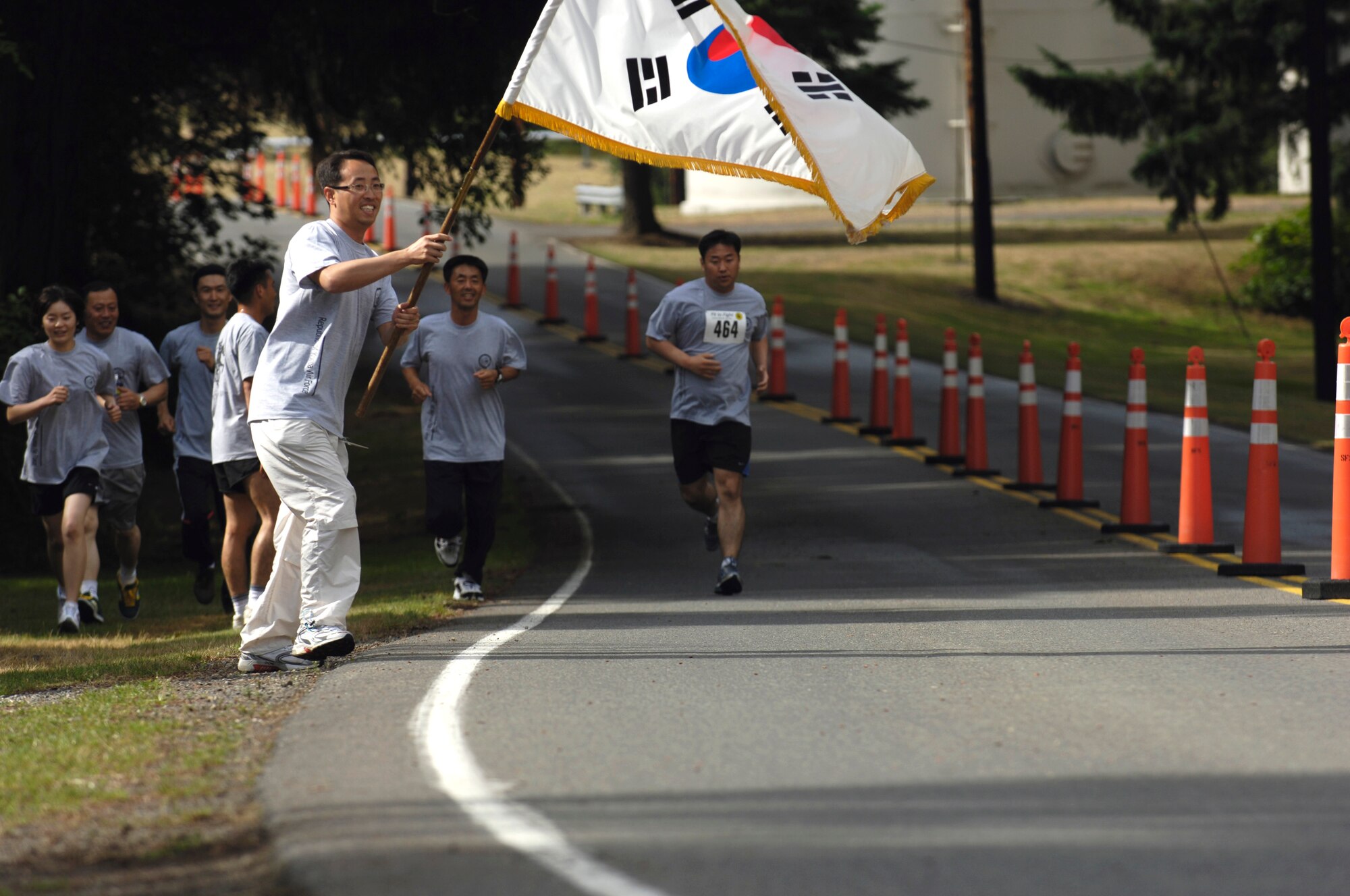 Republic of Korea Air Force Senior Master Sgt. Song Young Bok, a C-130 Hercules loadmaster, runs along with Lee Mukang, a C-130 pilot, during the Fit-to-Fight competition at Air Mobility Rodeo 2007 at McChord Air Force Base, Wash., July 21. Air Mobility Command's Rodeo 2007 is a readiness competition of U.S. and international mobility air forces.  It focuses on improving warfighting capabilities and support of the Global War on Terrorism.   (U.S. Air Force photo/Senior Airman Clay Lancaster)
(Released)

