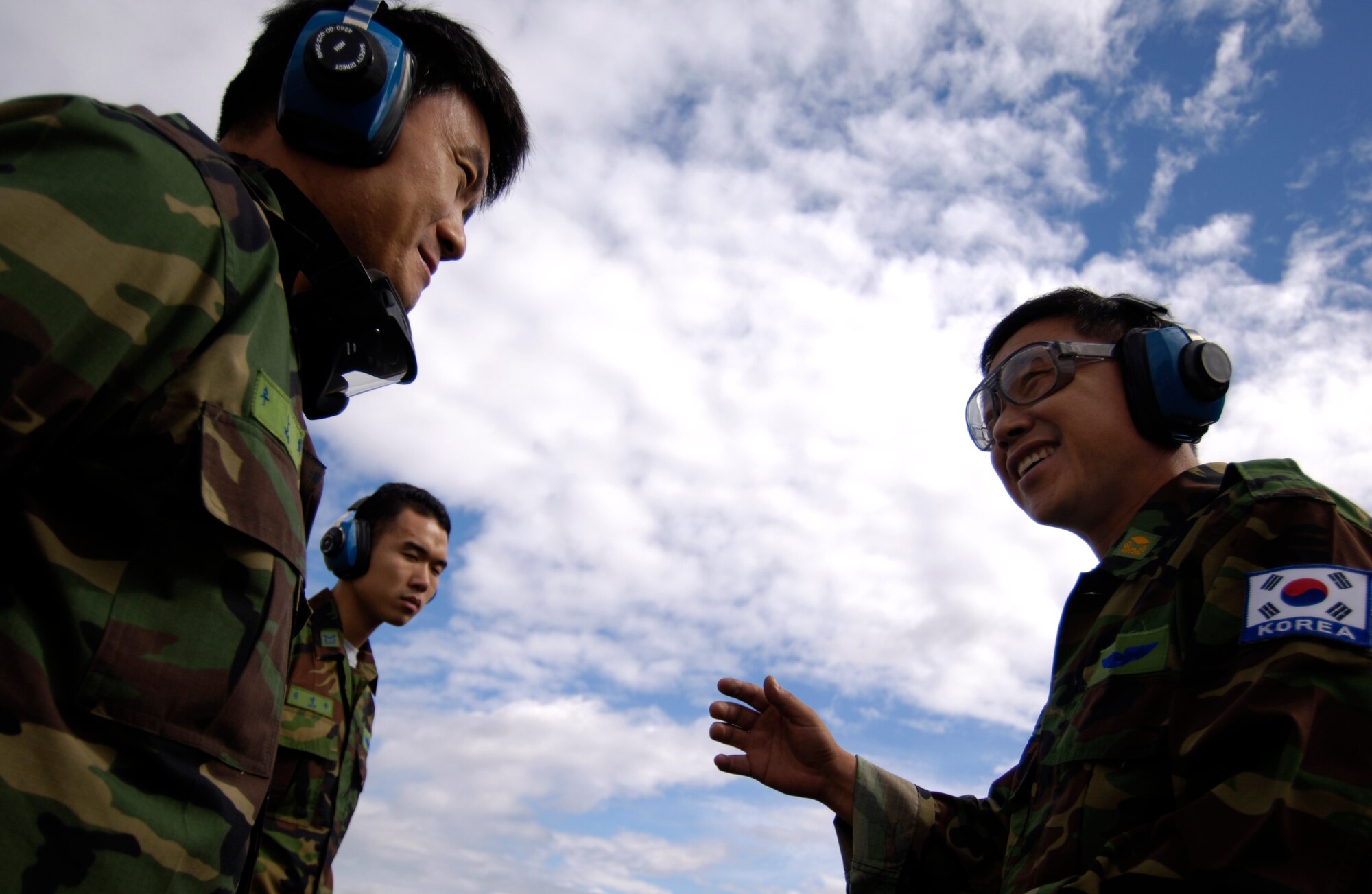 Republic of Korea crew chiefs chat as they prepare to launch a C-130 training mission in preparation for Rodeo 2007 at McChord Air Force Base, Wash., July 19. Rodeo 2007, hosted by Air Mobility Command, is a readiness competition of U.S. and international mobility air forces.  It focuses on improving warfighting capabilities and support of the Global War on Terrorism. (U.S. Air Force Photo/Tech. Sgt. Adrian Cadiz)


