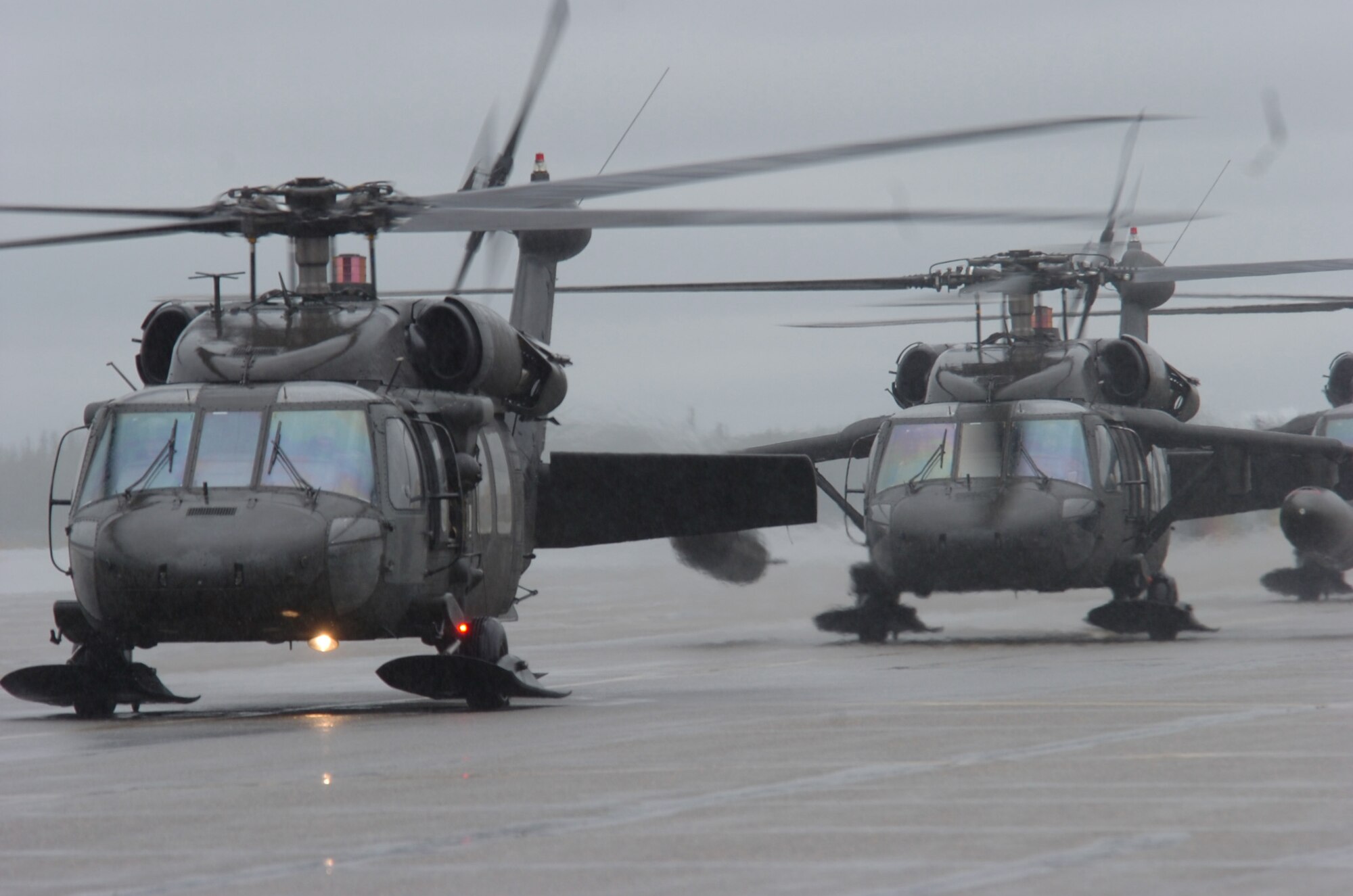 EIELSON AIR FORCE BASE, Alaska -- Several HH-60 Pave Hawk helicopters taxi enroute to a combat search and rescue training scenario at Red Flag Alaska 07-3, a multinational air combat training exercise held at the Pacific Alaska Range Complex. The Pave Hawks and crew are with the 210th Rescue Squadron from Kulis Air National Guard Base, Alaska. (U.S. Air Force photo by MSgt Brandt Smith)