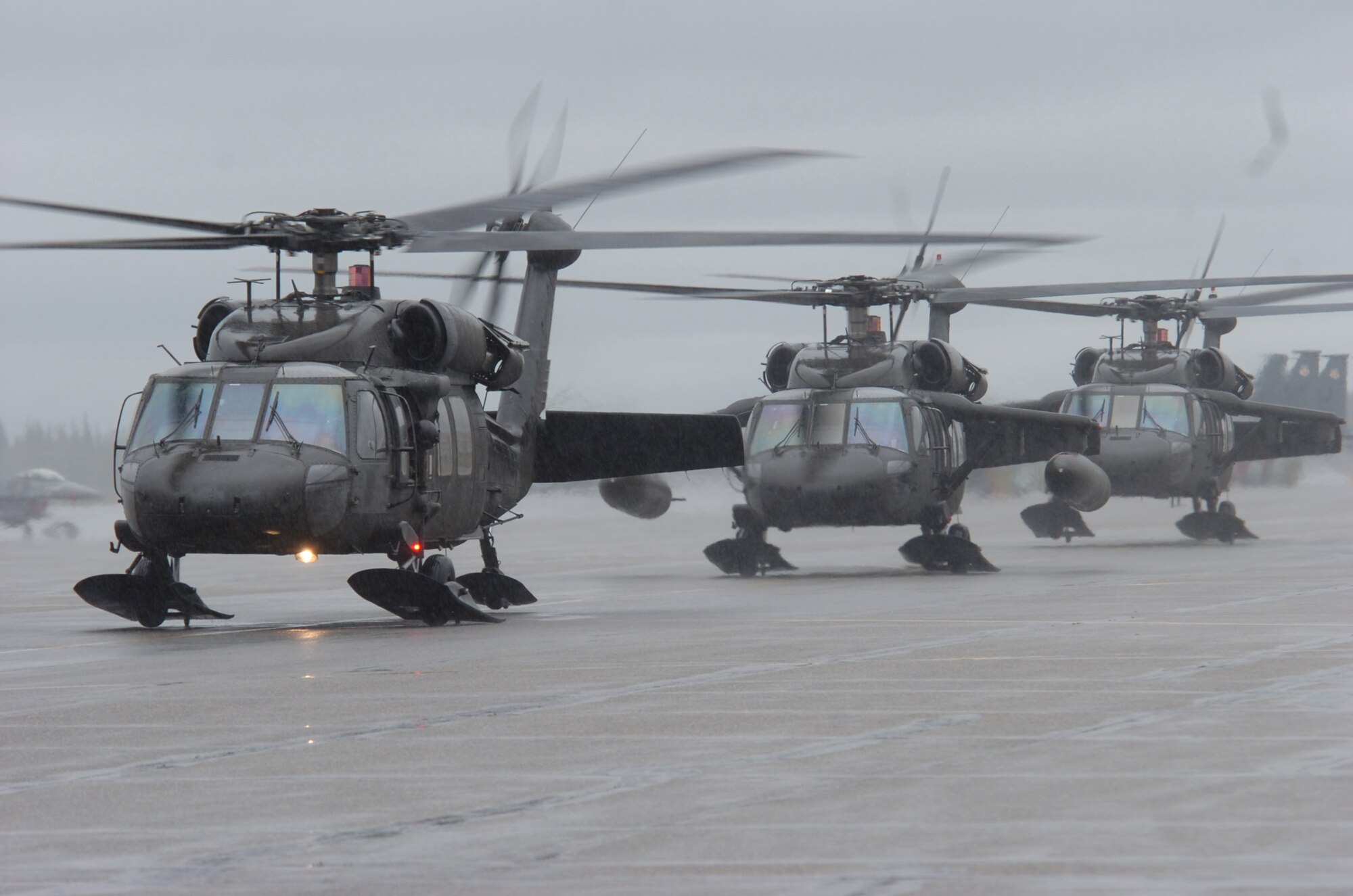 EIELSON AIR FORCE BASE, Alaska -- Several HH-60 Pave Hawk helicopters taxi enroute to a combat search and rescue training scenario at Red Flag Alaska 07-3, a multinational air combat training exercise held at the Pacific Alaska Range Complex. The Pave Hawks and crew are with the 210th Rescue Squadron from Kulis Air National Guard Base, Alaska. (U.S. Air Force photo by MSgt Brandt Smith)