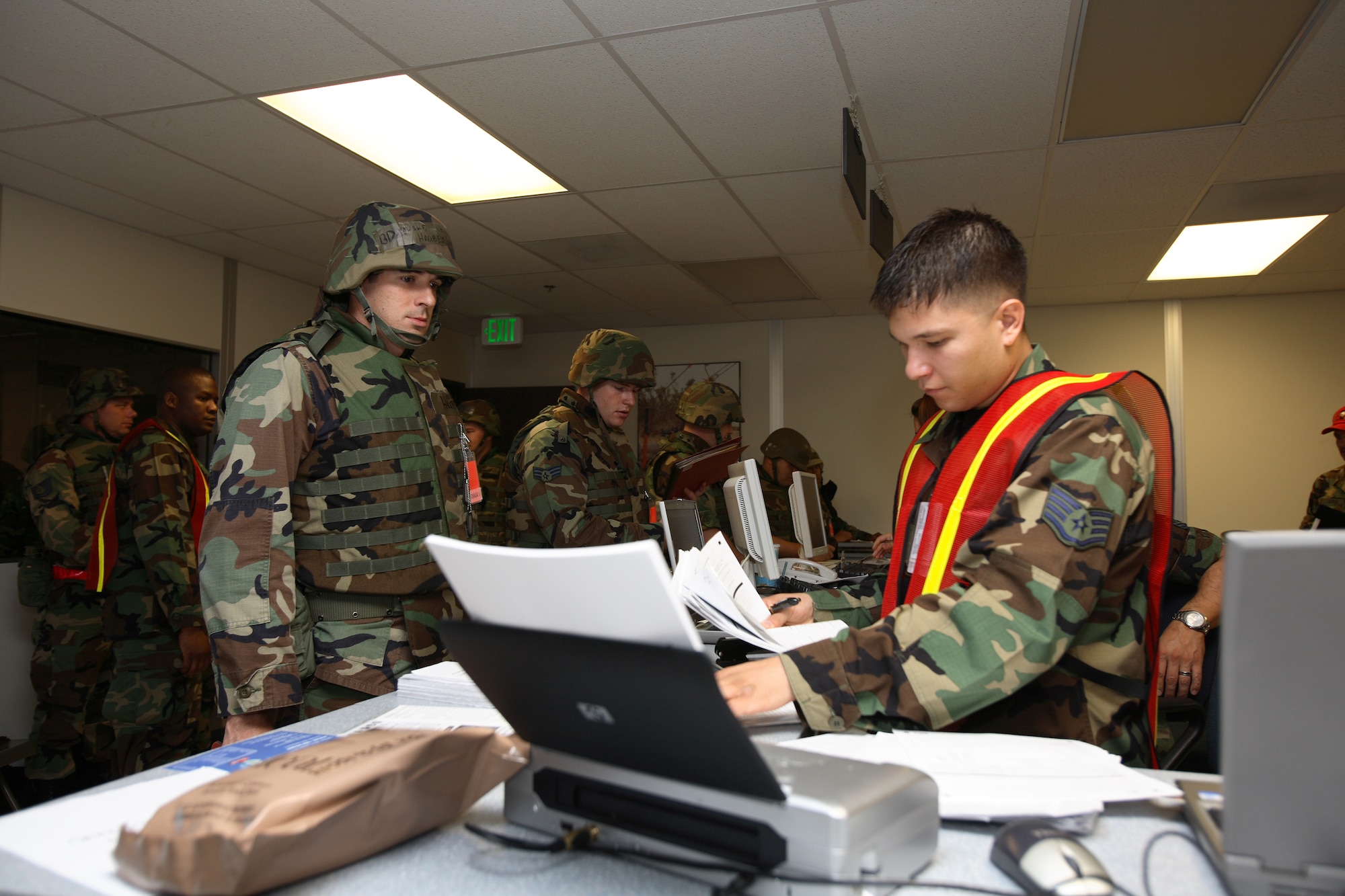 Edwards Airmen goes through the deployment line during the Phase I exercise July 19. This exercise was in preparation for the Phase I re-look starting Monday. (Photo by Jet Fabara)