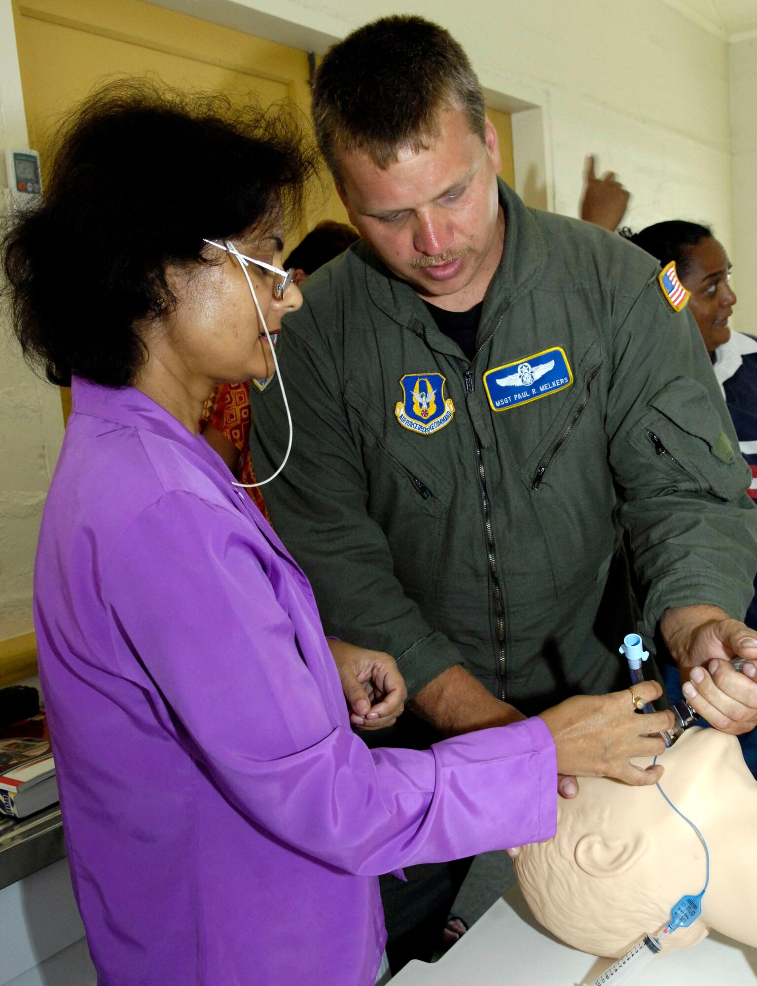 Master Sgt. Paul Melkers teaches proper intubation techniques to Dr. Jyoti Dubey at the Republic of Nauru Hospital July 21. Sergeant Melkers is part of a 12-person, joint-force Pacific Command team on a medical mission to the Republic of Nauru, a small island in the south Pacific, from July 21 through 28. He is an Air Force Reserve flight medic with the 446th Operations Group at McChord Air Force Base, Wash. (U.S. Air Force photo/Tech. Sgt. Chris Vadnais)