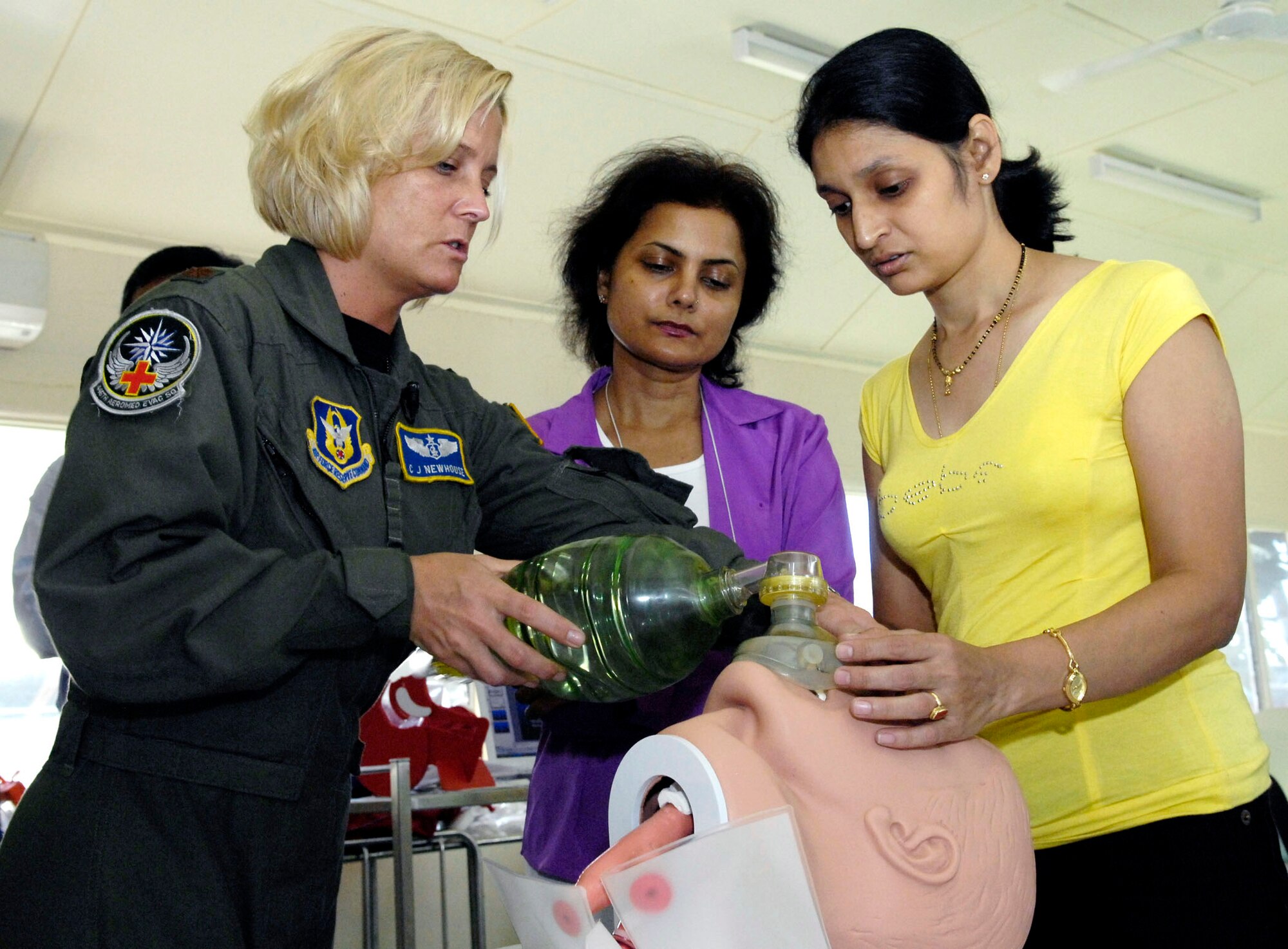 Maj. C.J. Newhouse conducts emergency airway training for Dr. Jyoti Dubey and Dr. Deepti Datey July 21 in the Republic of Nauru. Major Newhouse, an Air Force Reserve flight nurse with the 446th Aeromedical Evacuation Squadron, is part of a 12-person, joint-force Pacific Command medical team visiting the Pacific Island July 21 through 28. (U.S. Air Force photo/Tech. Sgt. Chris Vadnais)

