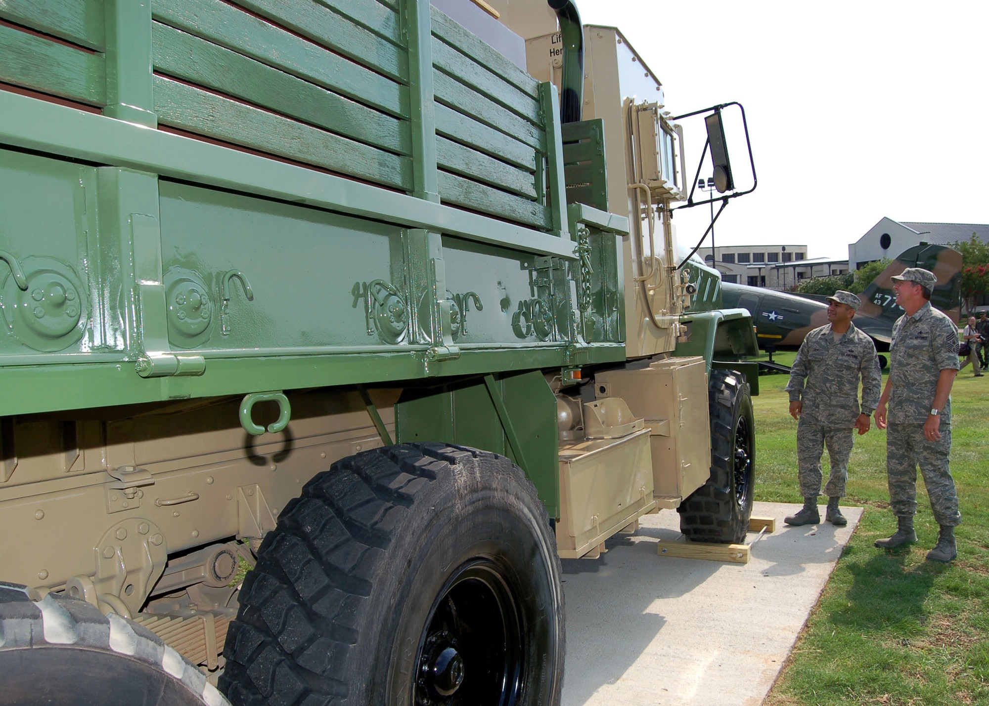 Chief Master Sgt. of the Air Force Rodney J. McKinley and his assistant, Senior Master Sgt. Jerry Tapia, inspect a convoy gun truck shortly before it was dedicated as a static display at the Air Force Enlisted Heritage Hall July 23 at Maxwell Air Force Base's Gunter Annex, Ala. (U.S. Air Force photo/Master Sgt. Lee Roberts) 