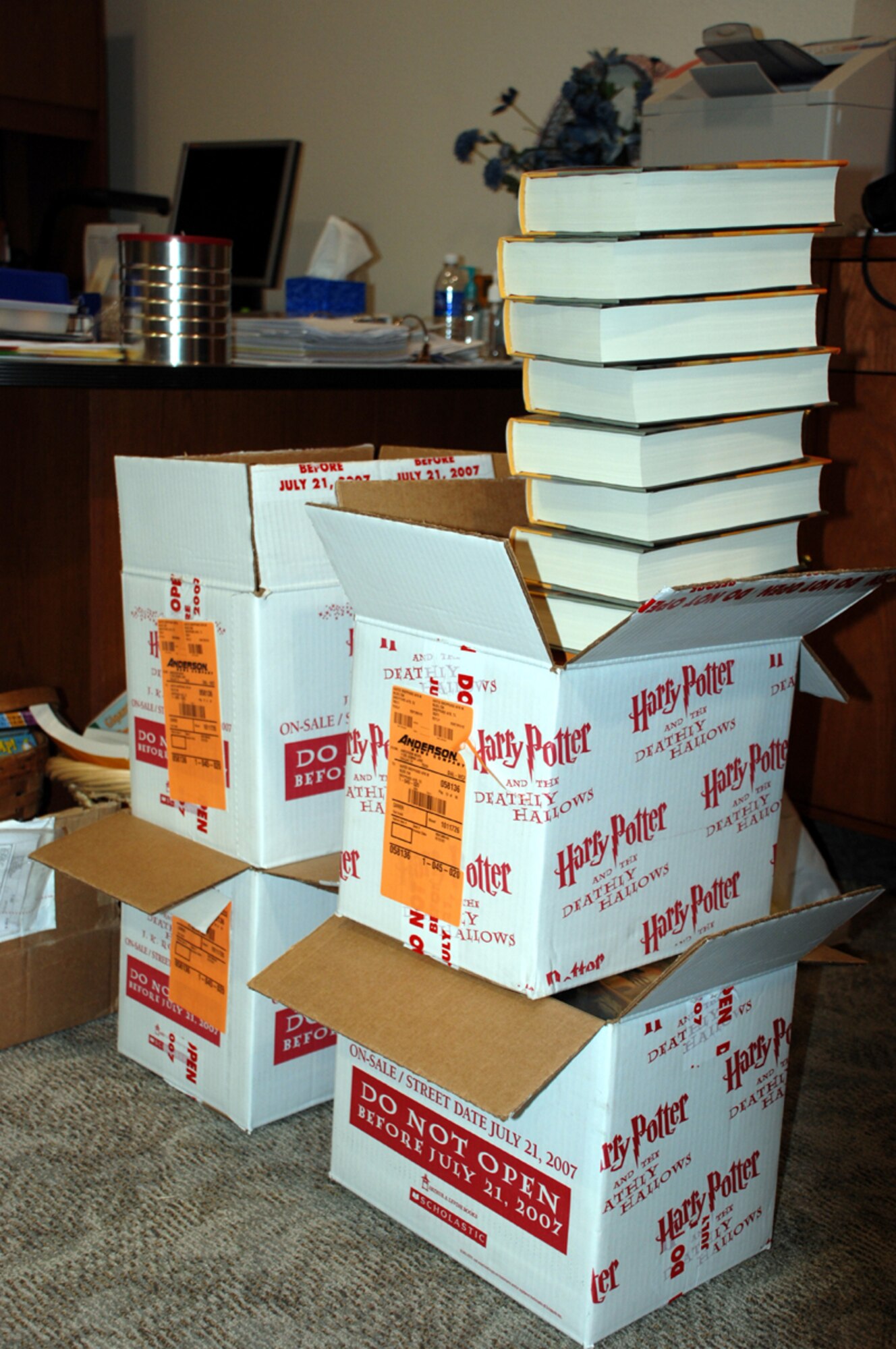 Cases of the seventh Harry Potter book wait to be sold at the Harry Potter release event, held by the base library, July 20. (U.S. Air Force photo/Airman 1st Class Jacob Corbin)