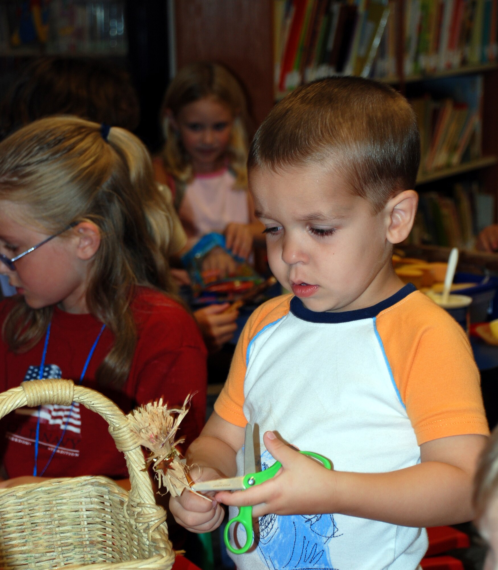 Noah Mcinnes, son of Staff Sgt. John Mcinnes, 361st Training Squadron, makes a broomstick at the Harry Potter release event, held at the base library, July 20. (U.S. Air Force photo/Airman 1st Class Jacob Corbin)
