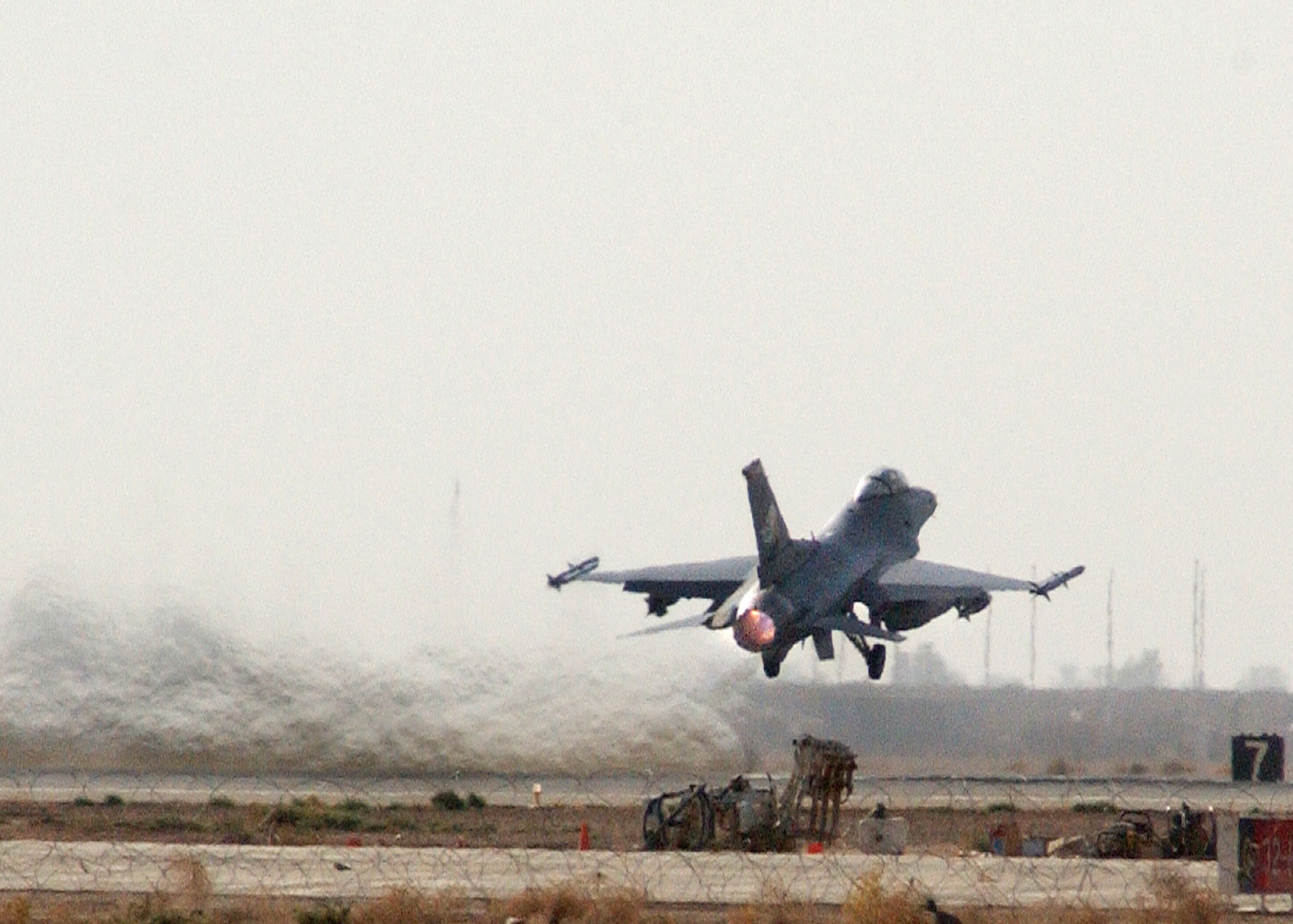 BALAD AIR BASE, Iraq -- An F-16 Fighting Falcon takes off for a combat mission in support of Operation Iraqi Freedom  here July 22. The two F-16s are deployed from the Oklahoma Air National Guard's 138th Fighter Wing at the Tulsa International Airport. (U.S. Air Force photo by Senior Airman Olufemi A. Owolabi)