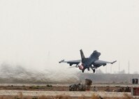 BALAD AIR BASE, Iraq -- An F-16 Fighting Falcon takes off for a combat mission in support of Operation Iraqi Freedom  here July 22. The two F-16s are deployed from the Oklahoma Air National Guard's 138th Fighter Wing at the Tulsa International Airport. (U.S. Air Force photo by Senior Airman Olufemi A. Owolabi)