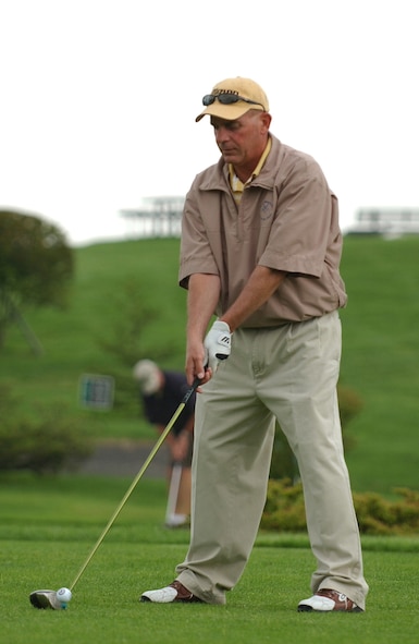 MISAWA AIR BASE JAPAN -- Chief Master Sgt. Brett Allison, 35th Operations Group, prepares to tee off on hole one during a golf tournament on Misawa Air Base, Misawa Japan, July 20, 2007. The golf tournament was held to raise money for the Fisher House. The Fisher House program is a unique private-public partnership that supports America's military in their time of need. Because members of the military and their families are stationed worldwide and must often travel great distances for specialized medical care, Fisher House Foundation donates "comfort homes," built on the grounds of major military and Veteran Affairs medical centers. These homes enable family members to be close to a family member at the most stressful times - during the hospitalization for an unexpected illness, disease, or injury. Annually, the Fisher House program serves more than 8,500 families, and have made available more than 2 million days of lodging to family members since the program originated in 1990. (U.S. Air Force photo by Airman 1st Class Benjamin Wilson) 