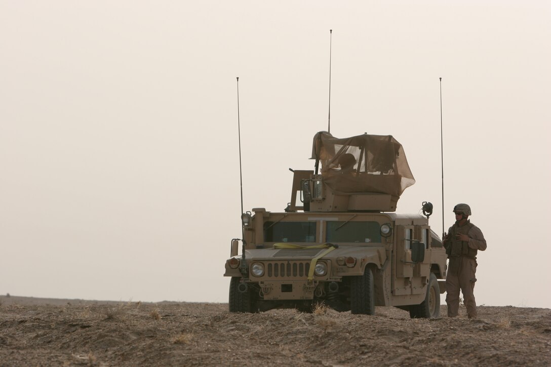 AL TAQADDUM, Iraq (July 25, 2007) ? Marines with 1st Battalion, 11th Marine Regiment patrol around the area here July 25.  1st Bn., 11th Marines frequently patrols the nearby area in defense of Camp Taqaddum.  The unit is based out of Marine Corps Base Camp Pendleton, Calif.