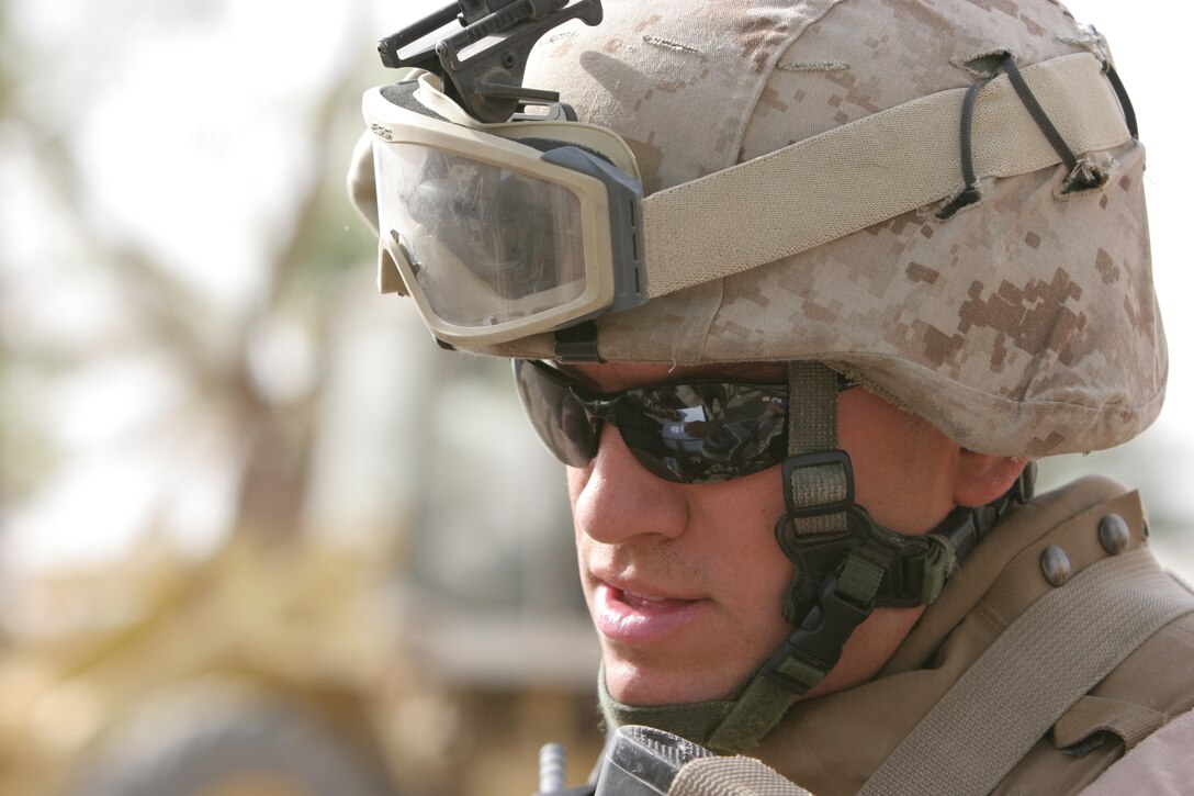 AL TAQADDUM, Iraq (July 25, 2007) ? Cpl. David B. Santy checks the serial numbers of AK-47 assault rifles belonging to the Iraqi police hopefuls of Al Madinah as Siyahiyah July 25. Marines with 1st Battalion, 11th Marine Regiment frequently patrol the nearby area referred to as ?Tourist Town? in defense of Camp Taqaddum.  Santy is an intelligence data specialist and Plattsburgh, N.Y., native with the battalion.