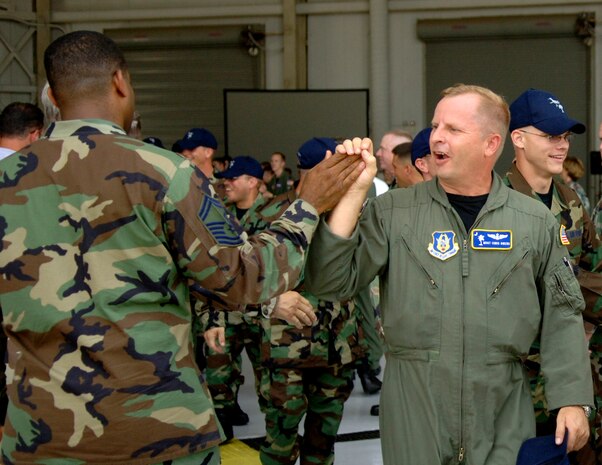 Master Sgt. Christopher Owens, 315th Aeromedical Evacuation technician is given a high five as he walks to a C-17 minutes before taking off to McCord AFB, Wash., for the 2007 AMC Rodeo. (U.S. Air Force photo/Airman 1st Class Nicholas Pilch) 