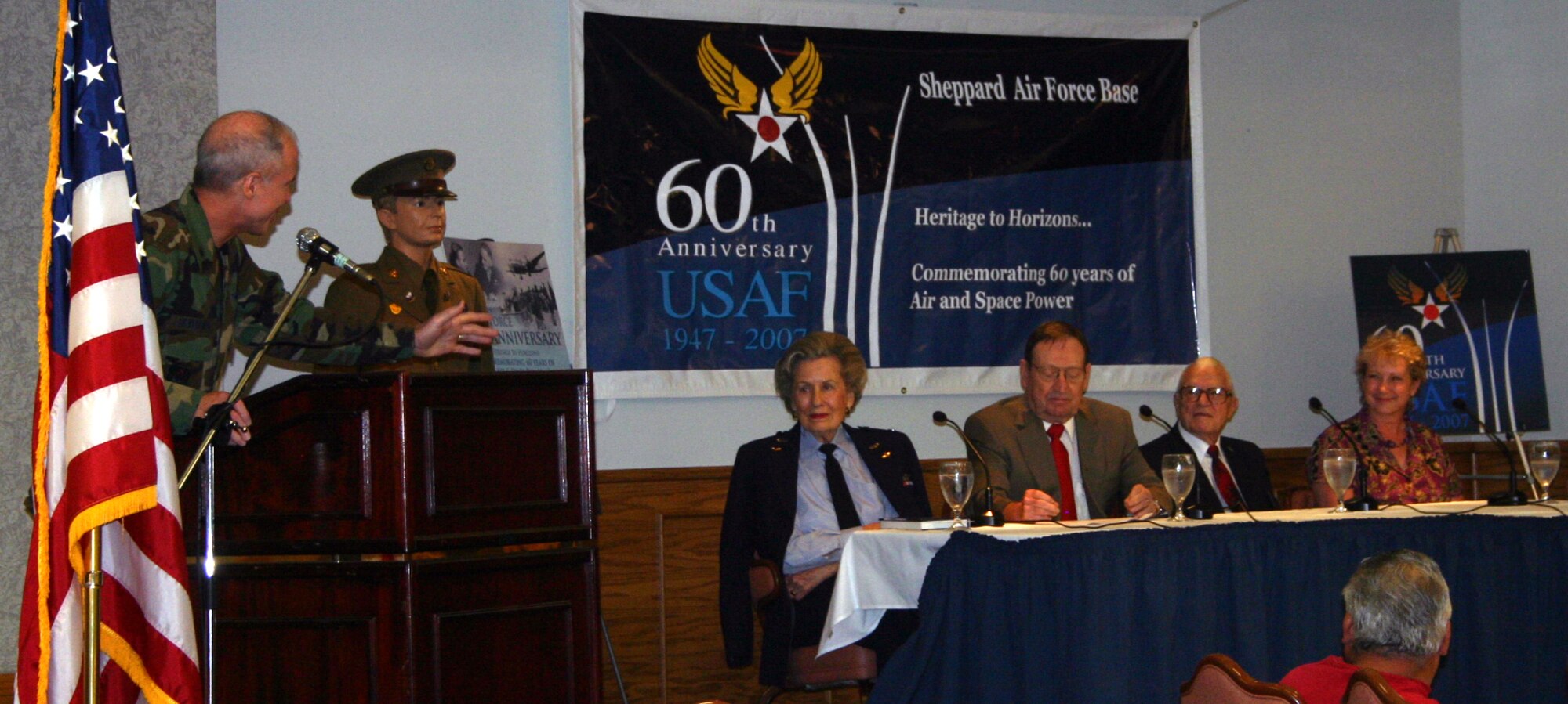 Brig. Gen. Richard Devereaux, 82nd Training Wing commander, speaks on the panel guests at the Lunch-n-Learn at the Sheppard Club July 19.  The panel guests are, from left: former WASP Marion Stegeman-Hodgson, retired Col. Jerry Hawkins, retired Maj. Wayne Kuschel and former WAF Pat Gonzalez of the 82nd TRW. (U.S. Air Force photo/Staff Sgt. Tonnette Thompson)