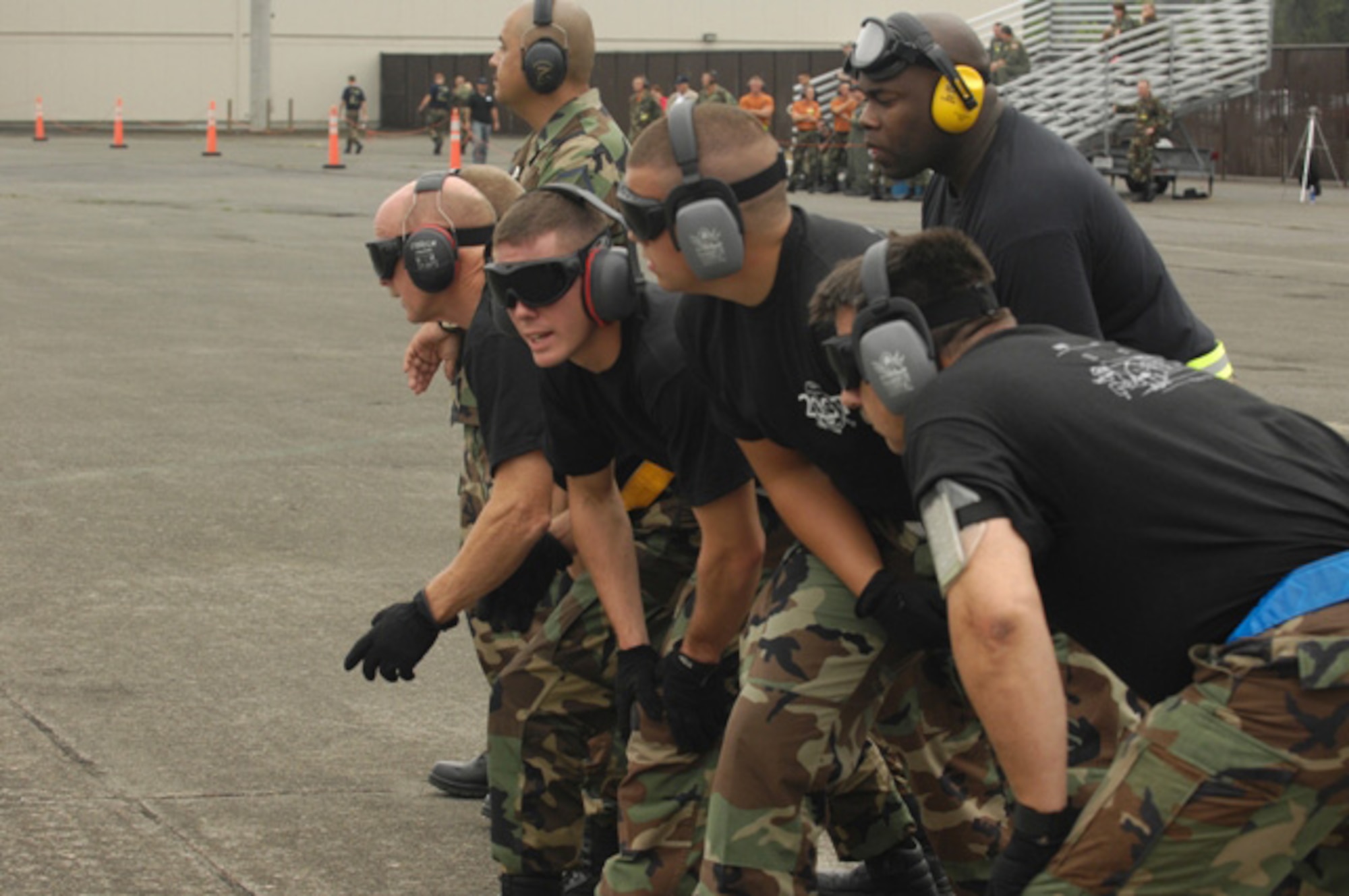 Airmen from the 315th Airlft Wing, Air Force Reserve Unit, Charleston Air Force Base, S.C., run out to A U.S. Air Force C-17 Globemaster III during the Aerial Ports Engine Running On Loads Competition for Air Mobility Rodeo 2007. Rodeo 2007 is a readiness competition of U.S. and international mobility air forces. It focuses on improving warfighting capabilities and support of the Global War on Terrorism.  (U.S. Air Force Photo/Airman 1st Class Nichelle Griffiths) 
