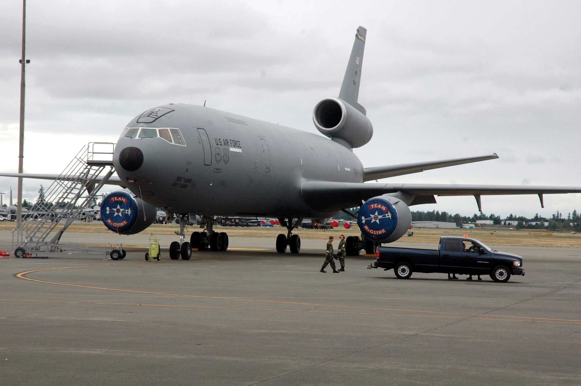 Aircraft maintenance Airmen from McGuire Air Force Base, N.J., prepare a KC-10 Extender for a mission during competition for Air Mobility Rodeo 2007 at McChord AFB, Wash., July 23.  Rodeo, sponsored by Air Mobility Command, is a readiness competition for U.S. and international mobility air forces.  Rodeo 2007 is the largest Rodeo competition to date.  (U.S. Air Force Photo/Tech. Sgt. Scott T. Sturkol)
