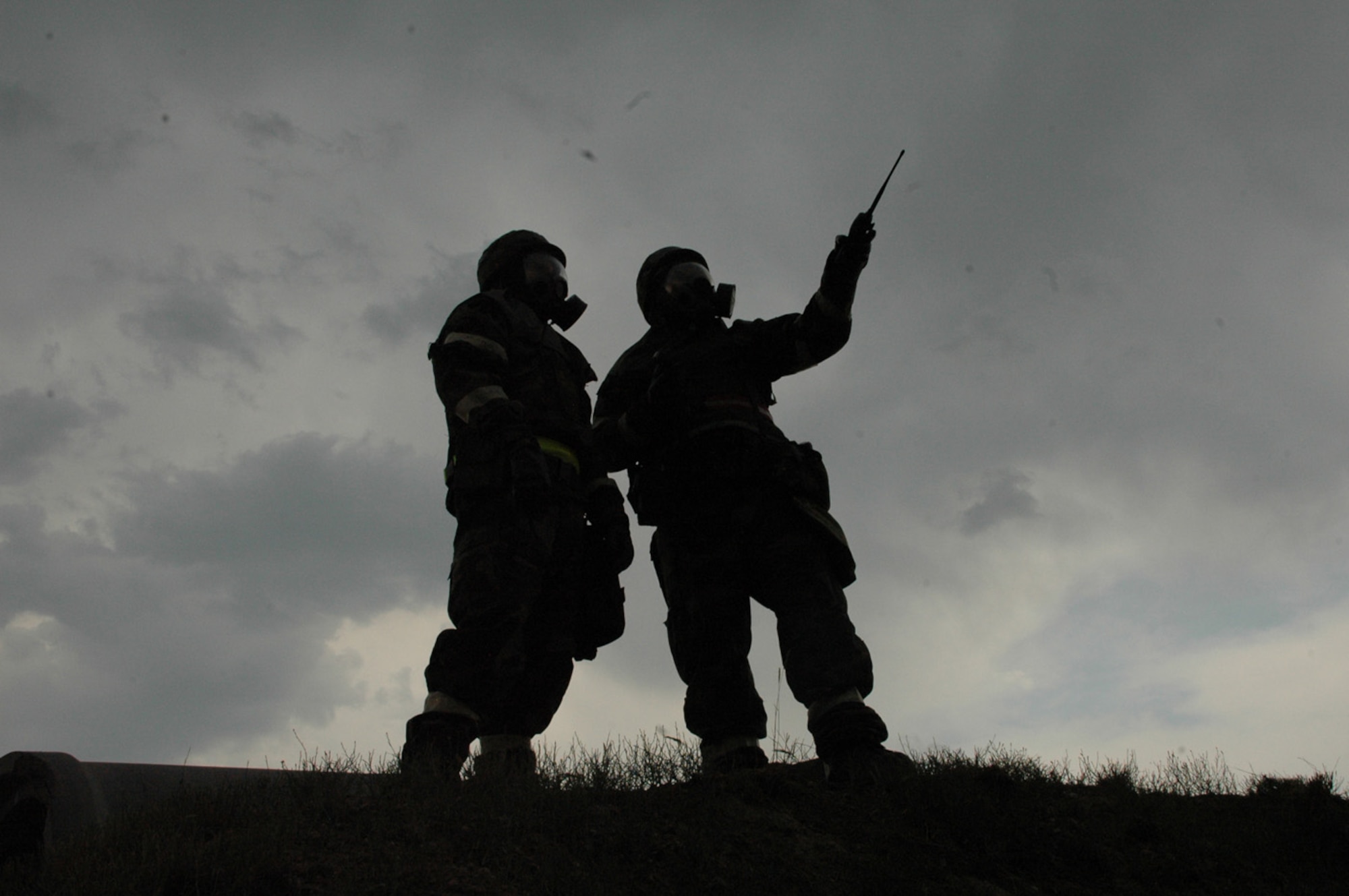 Staff Sgt. Chad Quin, 90th Operations Support Squadron, describes the weather conditions of an approaching thunderstorm to 2nd Lt. Jonathan Needham, 90th Civil Engineer Squadron during the Field Warrior Phase I/II Deployment Exercise July 12. One hundred and fifty Airmen participated in the exercise (Photos by Airman Alex Martinez).
