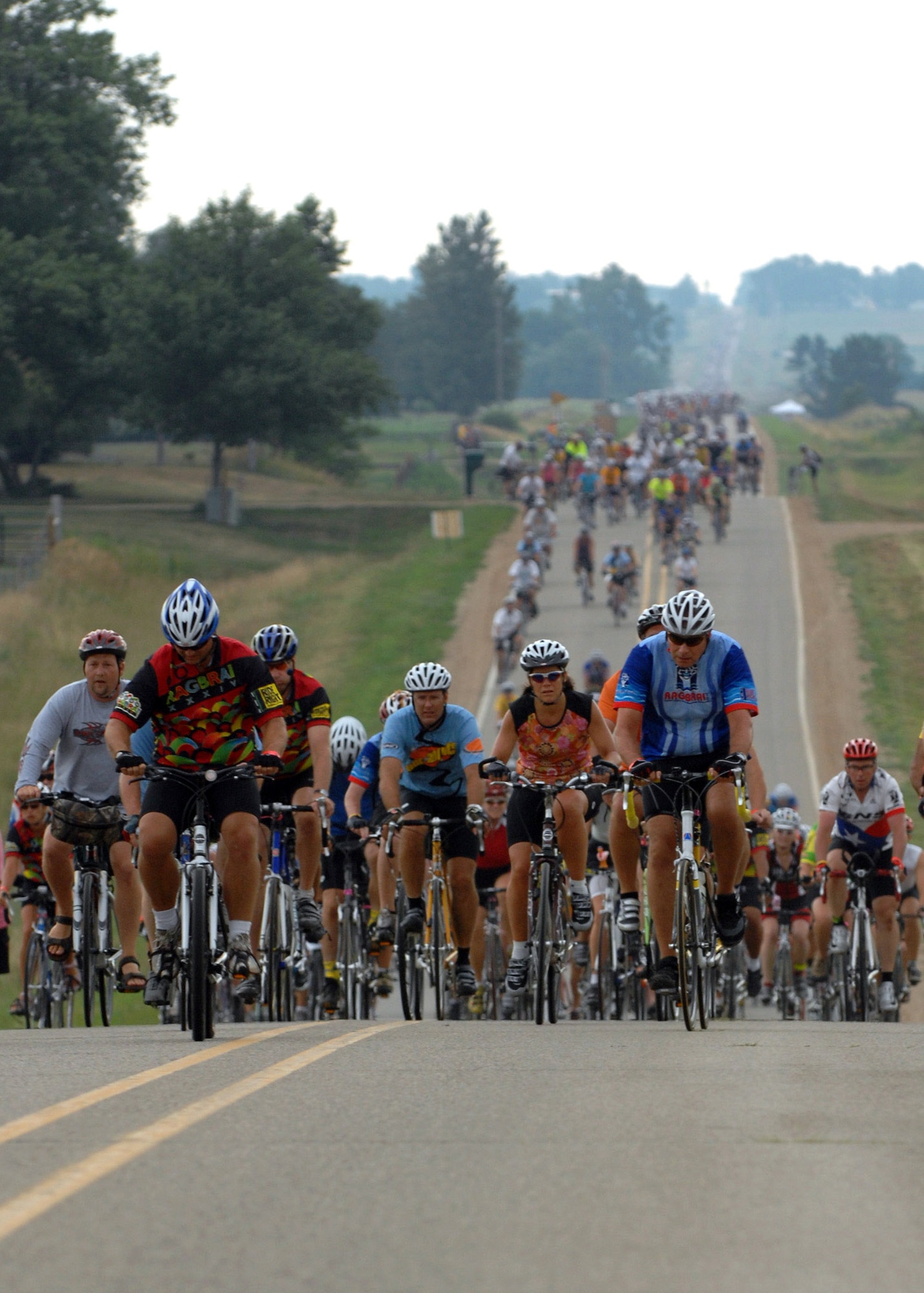 Cyclists ride across the Iowa countryside from Spencer to Humboldt July 23 during the third day of the Register's Annual Great Bike Ride Across Iowa, known as RAGBRAI, a cycling event sponsored by the Des Moines Register newspaper.  This is the 13th year the Air Force Cycling Team has participated in the RAGBRAI to support Air Force recruiting.  (U.S. Air Force photo/Airman 1st Class Joanna M. Kresge)