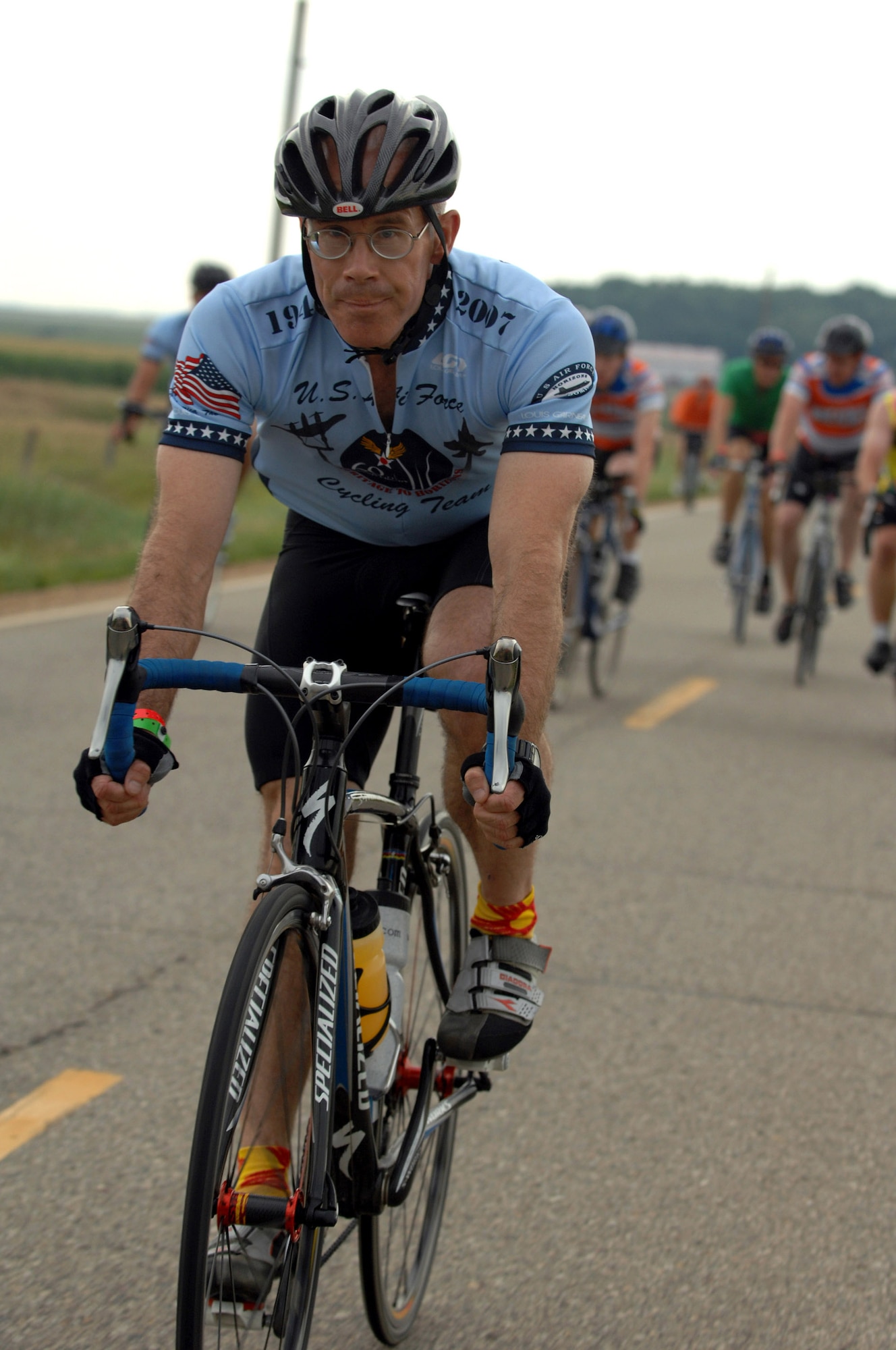 A member of the U.S. Air Force Cycling Team rides his bicycle from Spencer to Humboldt, Iowa, along with other participants July 23 during the third day of the Register's Annual Great Bike Ride Across Iowa, known as RAGBRAI, a cycling event sponsored by the Des Moines Register newspaper.  This is the 13th year the Air Force Cycling Team has participated in the RAGBRAI to support Air Force recruiting.  (U.S. Air Force photo/Airman 1st Class Joanna M. Kresge)