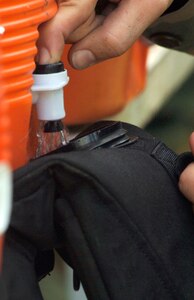 Charleston Airmen have the secret to beating the South Carolina heat in their hands -- a cup of water. (U.S. Air Force photo/Staff Sgt. April Quintanilla)