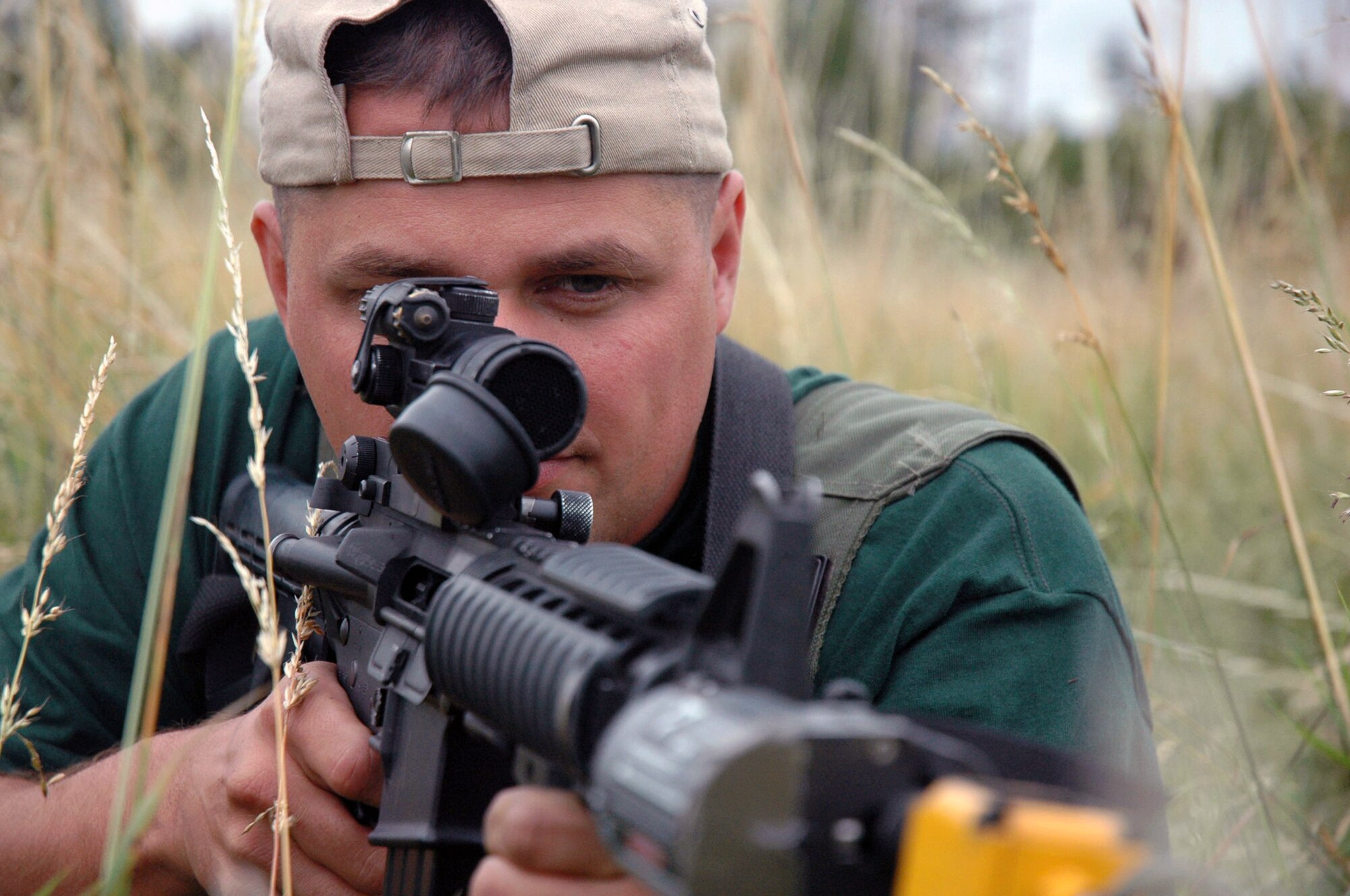 Tech. Sgt. Roy Carter, an "opposing forces" role player for the Air Mobility Command's Rodeo 2007 security forces tactics competition, takes aim July 23 at McChord Air Force Base, Wash. Sergeant Carter is from the Air Force Expeditionary Center's Mobility Operations School Det. 1 at Hurlburt Field, Fla. The security forces tactics competition is one of the ground events for Rodeo. Rodeo 2007, sponsored by Air Mobility Command, is a readiness competition for U.S. and international mobility air forces. (U.S. Air Force photo/Tech. Sgt. Scott T. Sturkol) 
