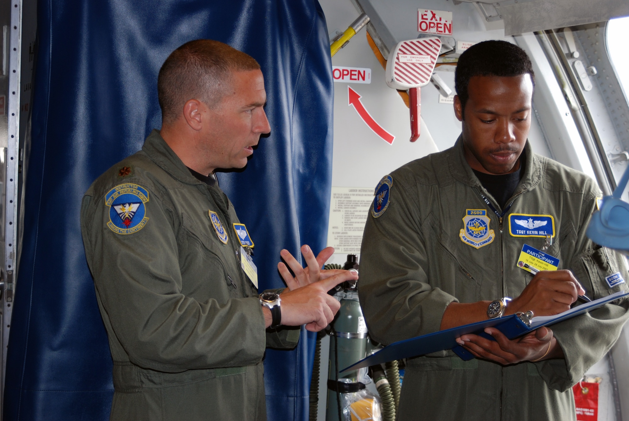 Maj. Steve Haren, a KC-10 Extender pilot, and Tech. Sgt. Kevin Hill, a boom operator, both from the 32nd Air Refueling Squadron at McGuire Air Force Base, N.J., prepare their plane for a competition mission for Air Mobility Rodeo 2007 at McChord AFB, Wash., July 23.  More than 65 people and three aircraft -- two KC-10 Extenders and one C-17 Globemaster III -- from McGuire are participating in Rodeo.  Rodeo, sponsored by Air Mobility Command, is a readiness competition for U.S. and mobility air forces.  (U.S. Air Force Photo/Airman 1st Class Rebekah Phy)